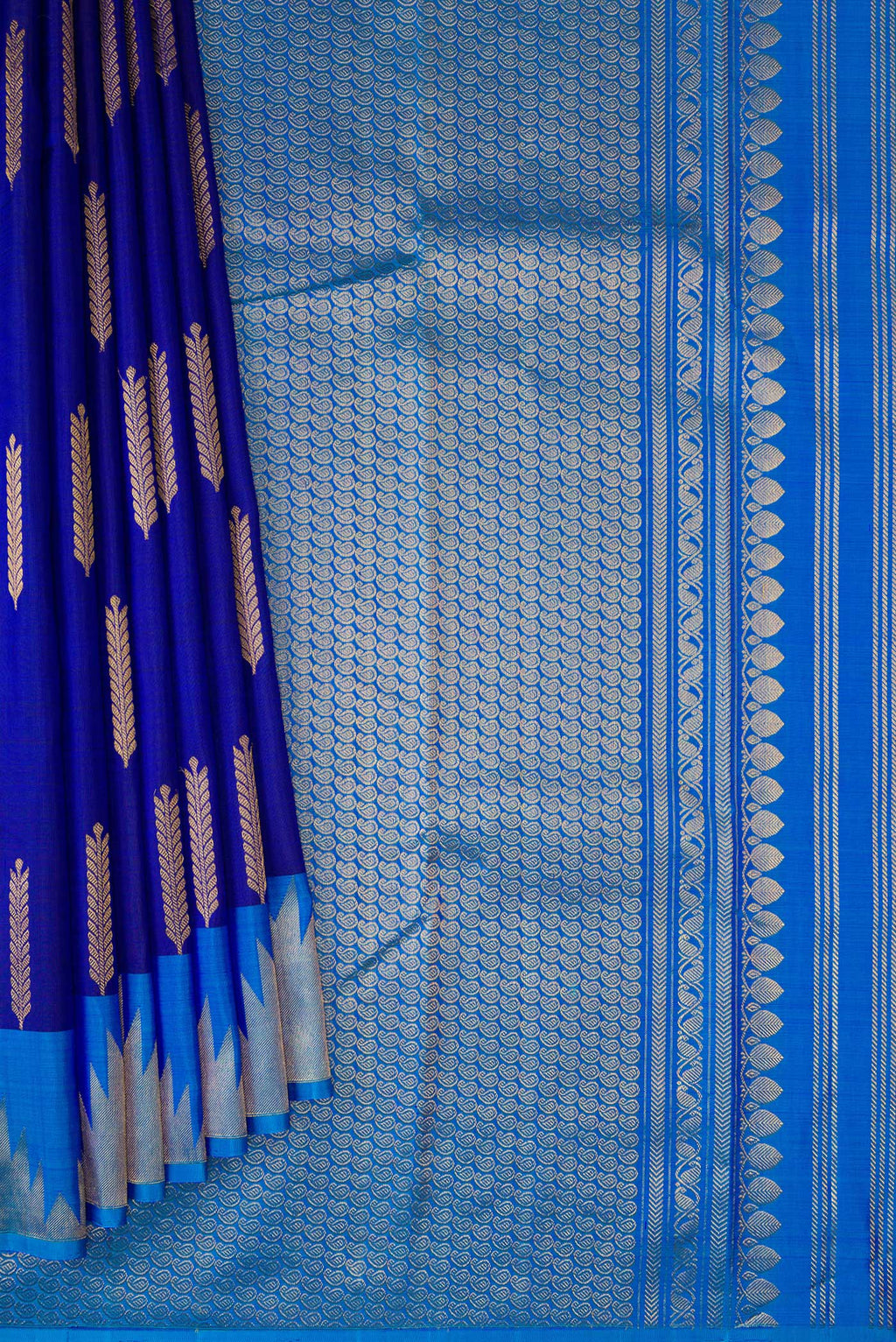Pleats and pallu of Navy Blue Kanjivaram Silk Saree with Zari Butta on the body and Temple Border. 