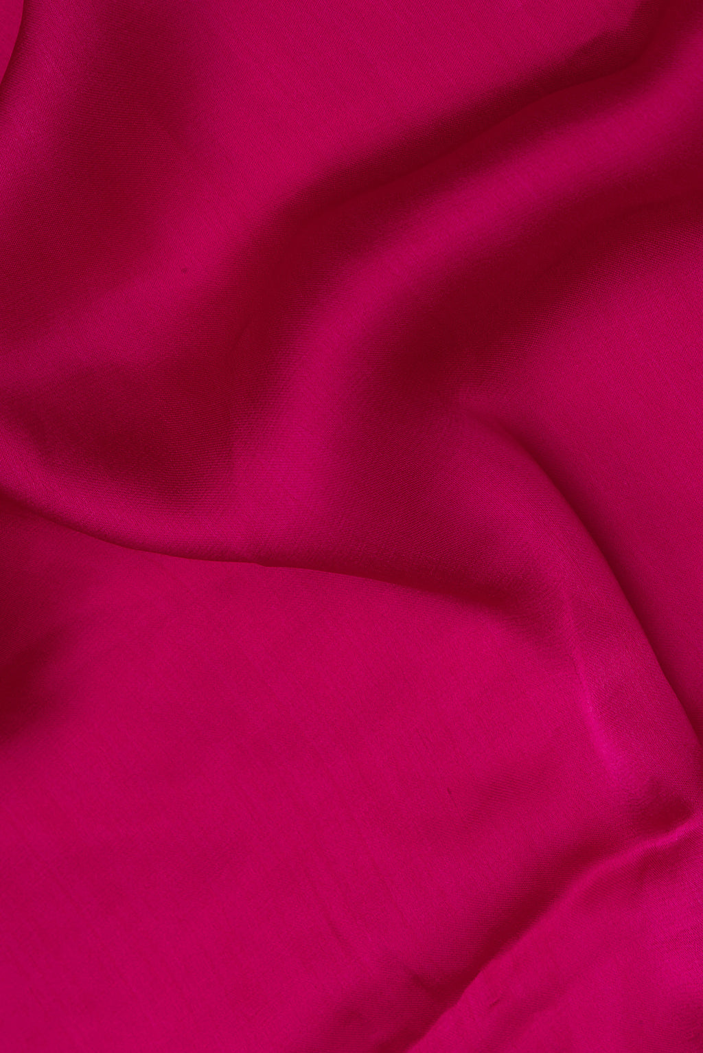 Close up of Dark Pink Crepe Saree with Plain Body and Embroidered Border.  displaying folds