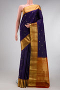 Navy Blue Kanchipuram Silk Saree with Zari Butta on the body and Zari Border.  displayed on a mannequin