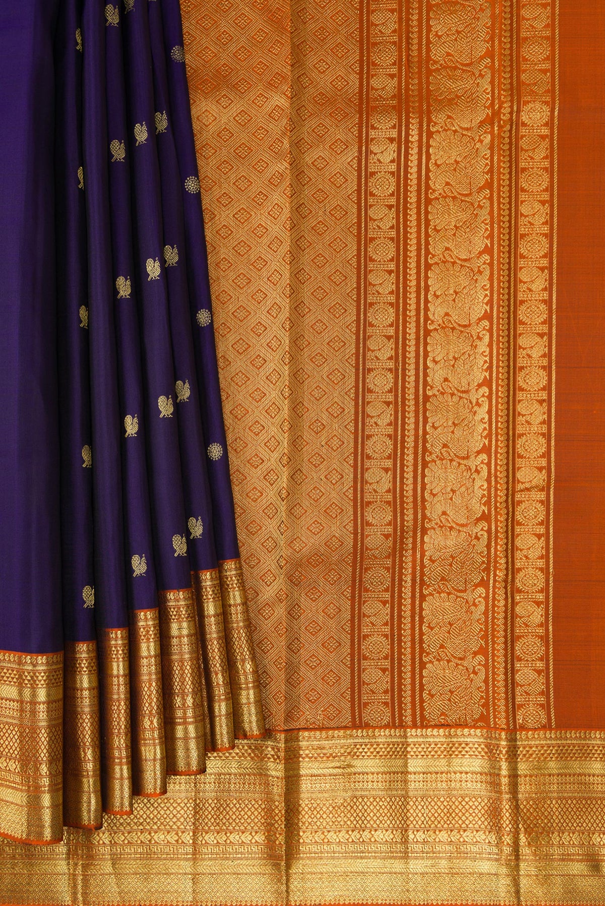 Pleats and pallu of Navy Blue Kanchipuram Silk Saree with Zari Butta on the body and Zari Border. 