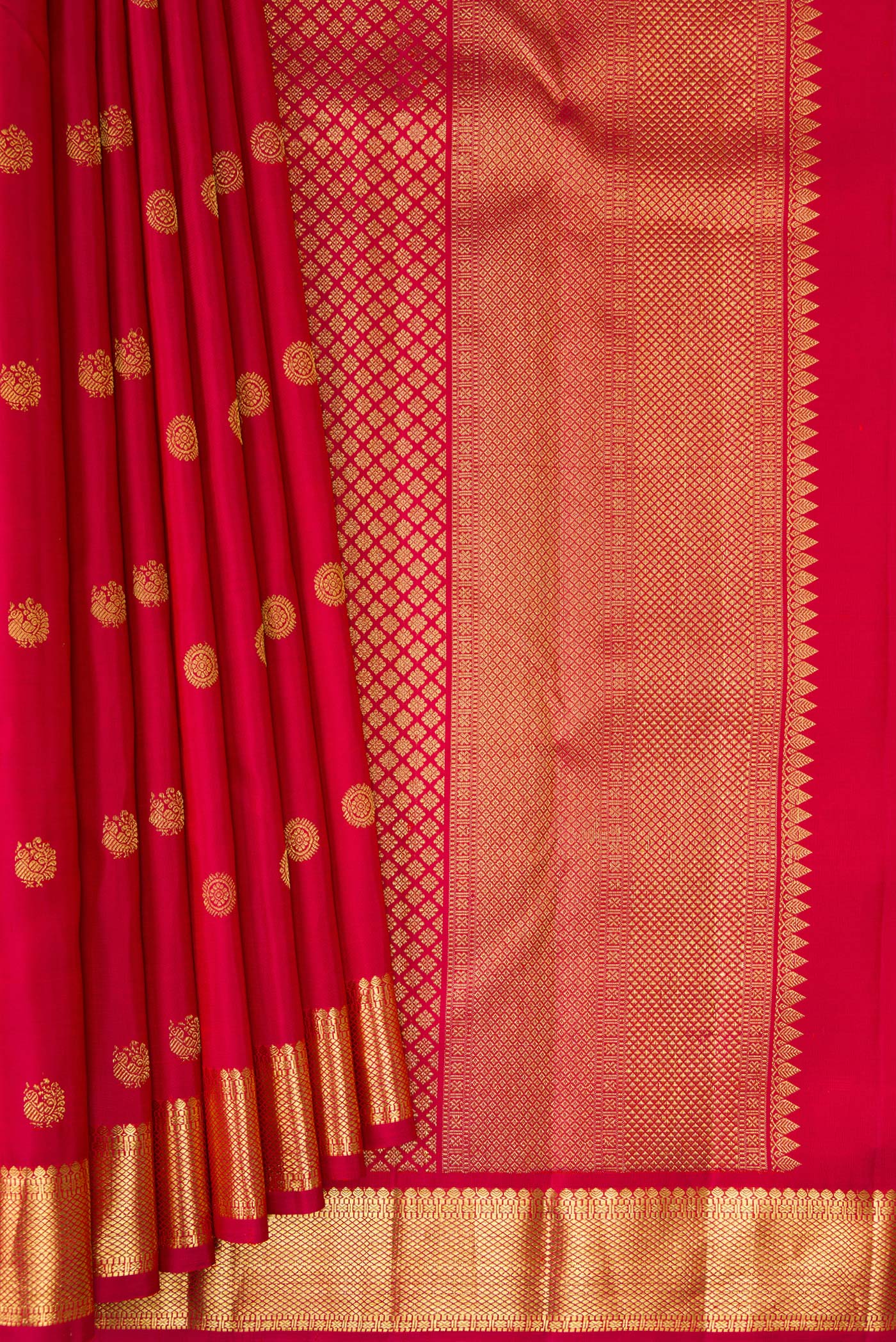 Pleats and pallu of Maroon Kanchipuram Silk Saree with Zari Butta on the body and Zari Border. 