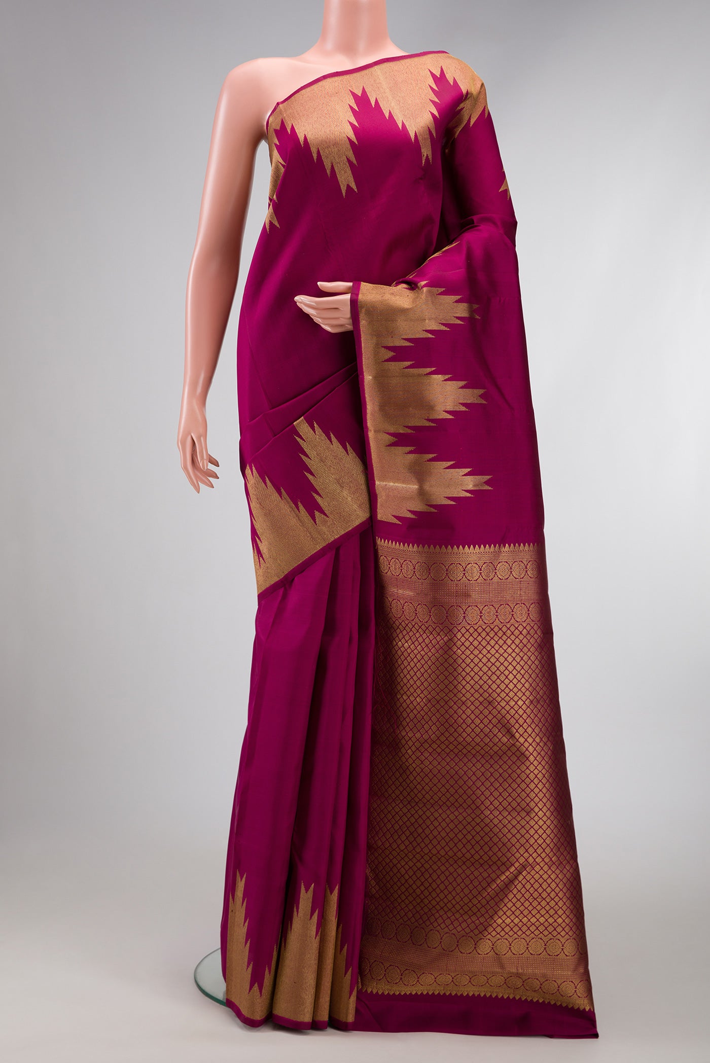 Magenta Dual Tone Kanchipuram Silk Saree with Plain Body and Temple Border.  displayed on a mannequin