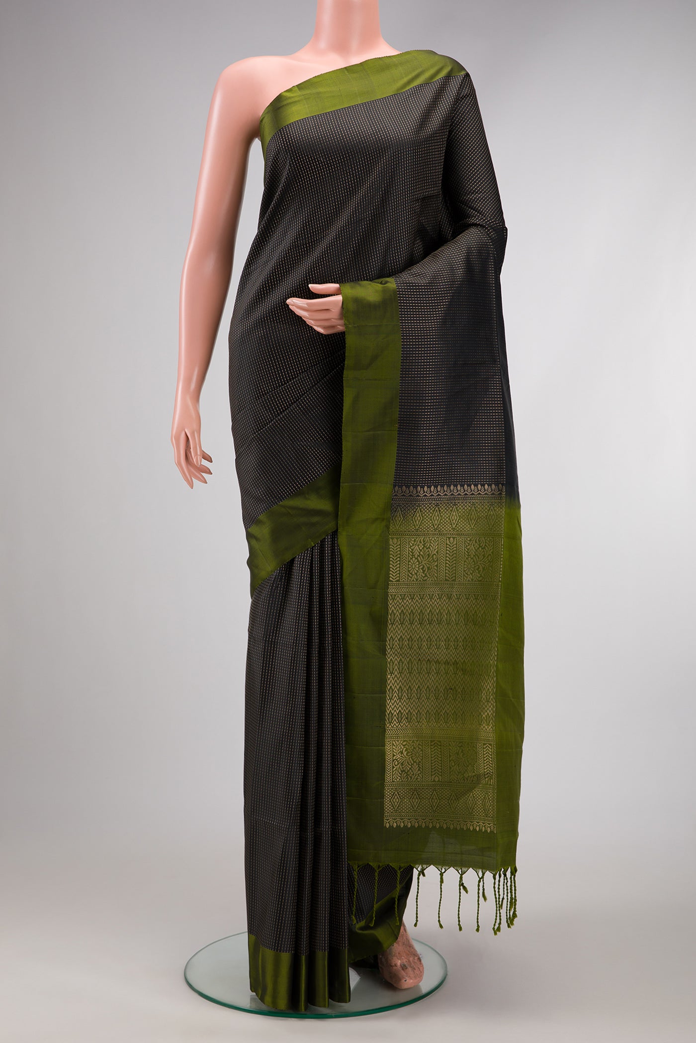 Black Soft Silk Saree with Stripes on the body and Zari Border.  displayed on a mannequin