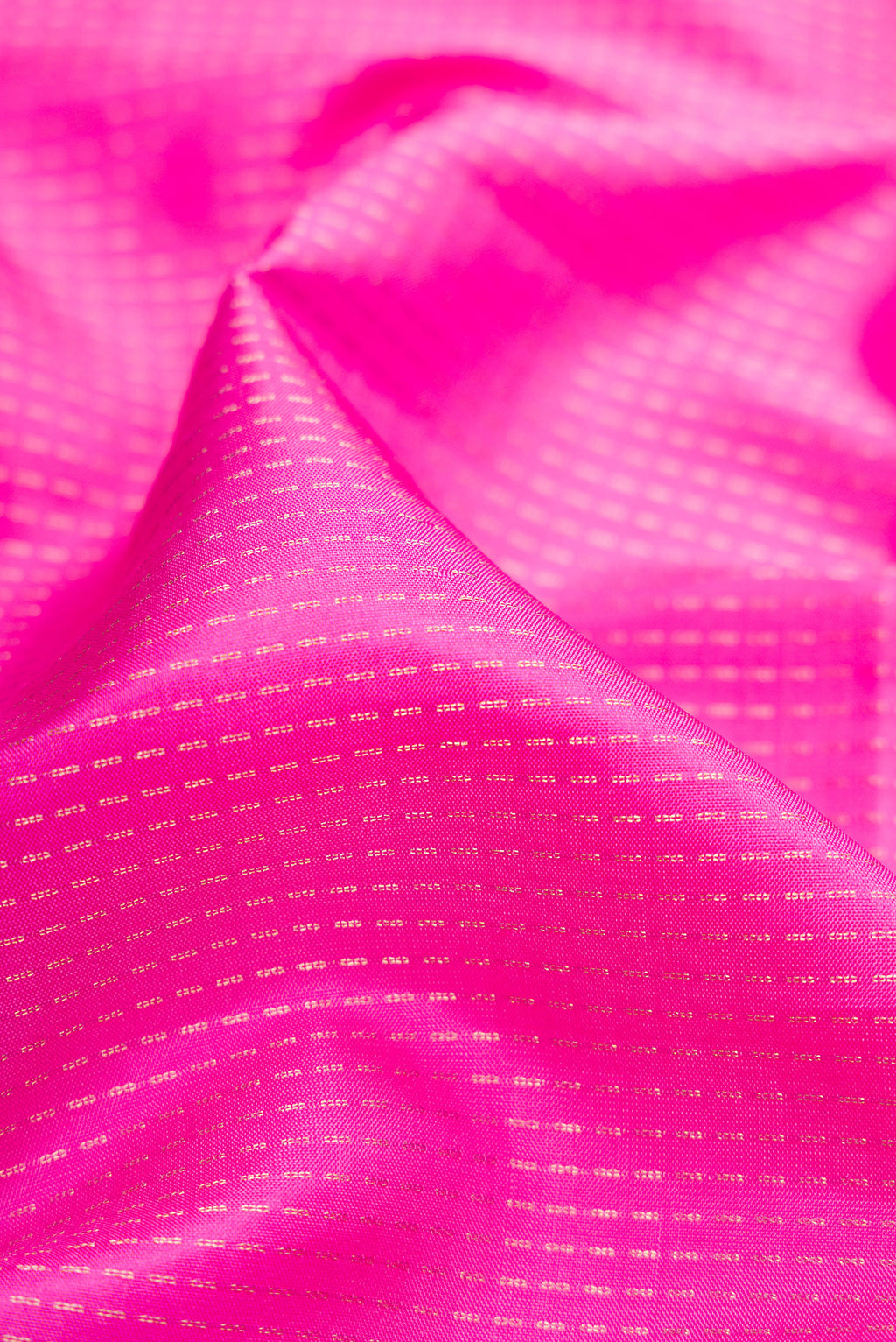 Close up of Pink Soft Silk Saree with Stripes on the body and Zari Border.  displaying folds