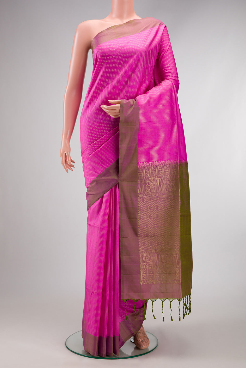 Pink Soft Silk Saree with Stripes on the body and Zari Border.  displayed on a mannequin