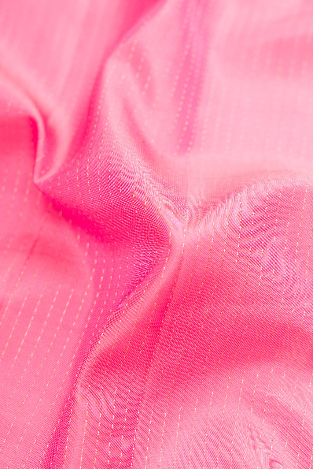 Close up of Pink Dual Tone Soft Silk Saree with Stripes on the body and Fancy Border.  displaying folds
