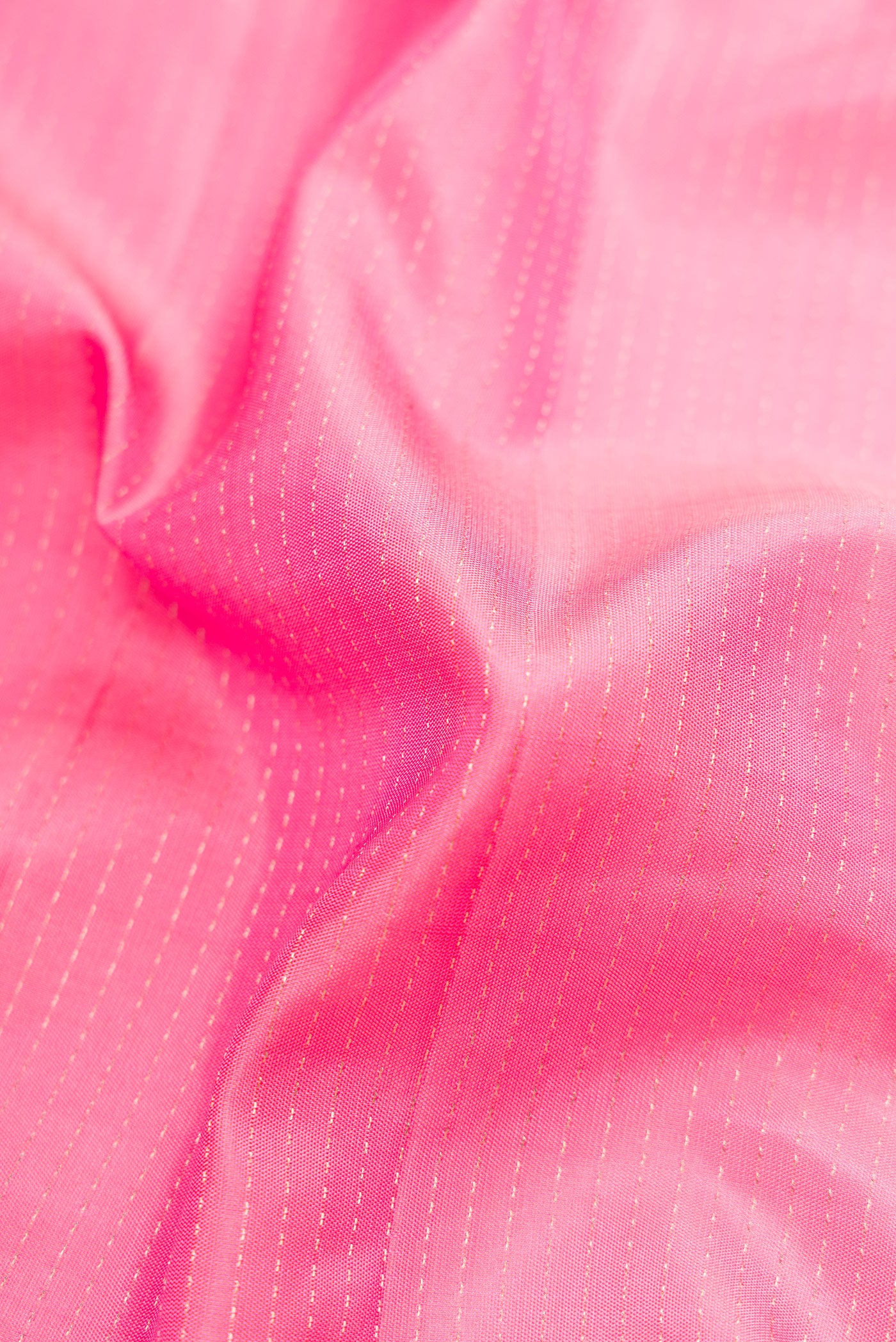 Close up of Pink Dual Tone Soft Silk Saree with Stripes on the body and Fancy Border.  displaying folds