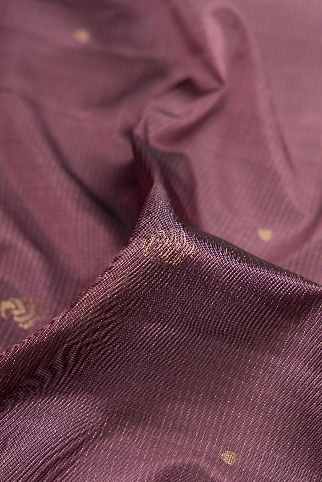 Close up of Purple Dual Tone Soft Silk Saree with Stripes on the body and Zari Border.  displaying folds