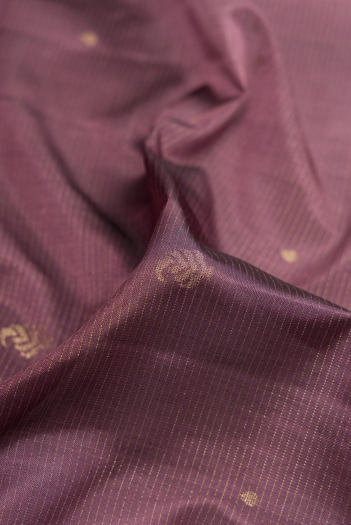 Close up of Purple Dual Tone Soft Silk Saree with Stripes on the body and Zari Border.  displaying folds
