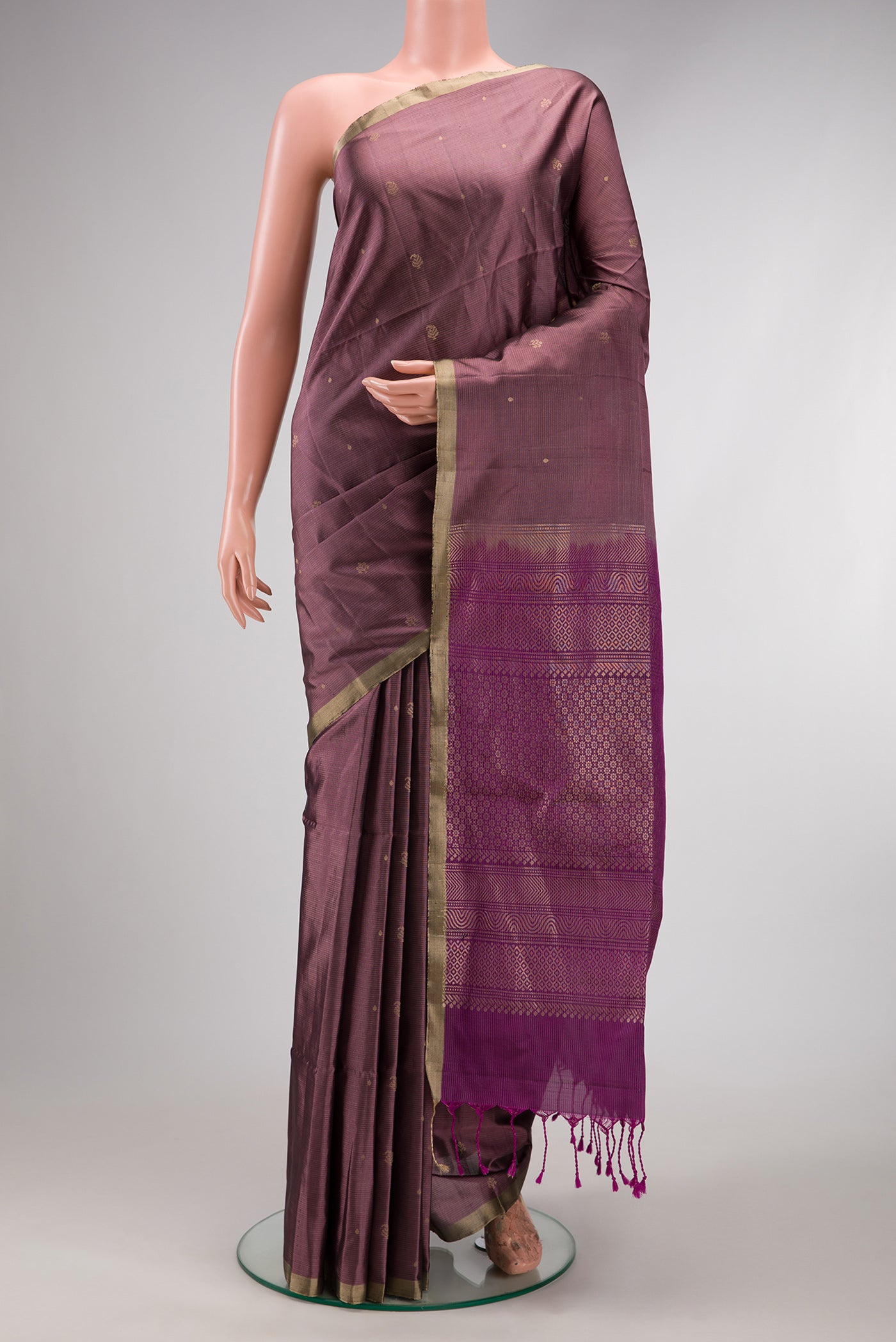 Purple Dual Tone Soft Silk Saree with Stripes on the body and Zari Border.  displayed on a mannequin