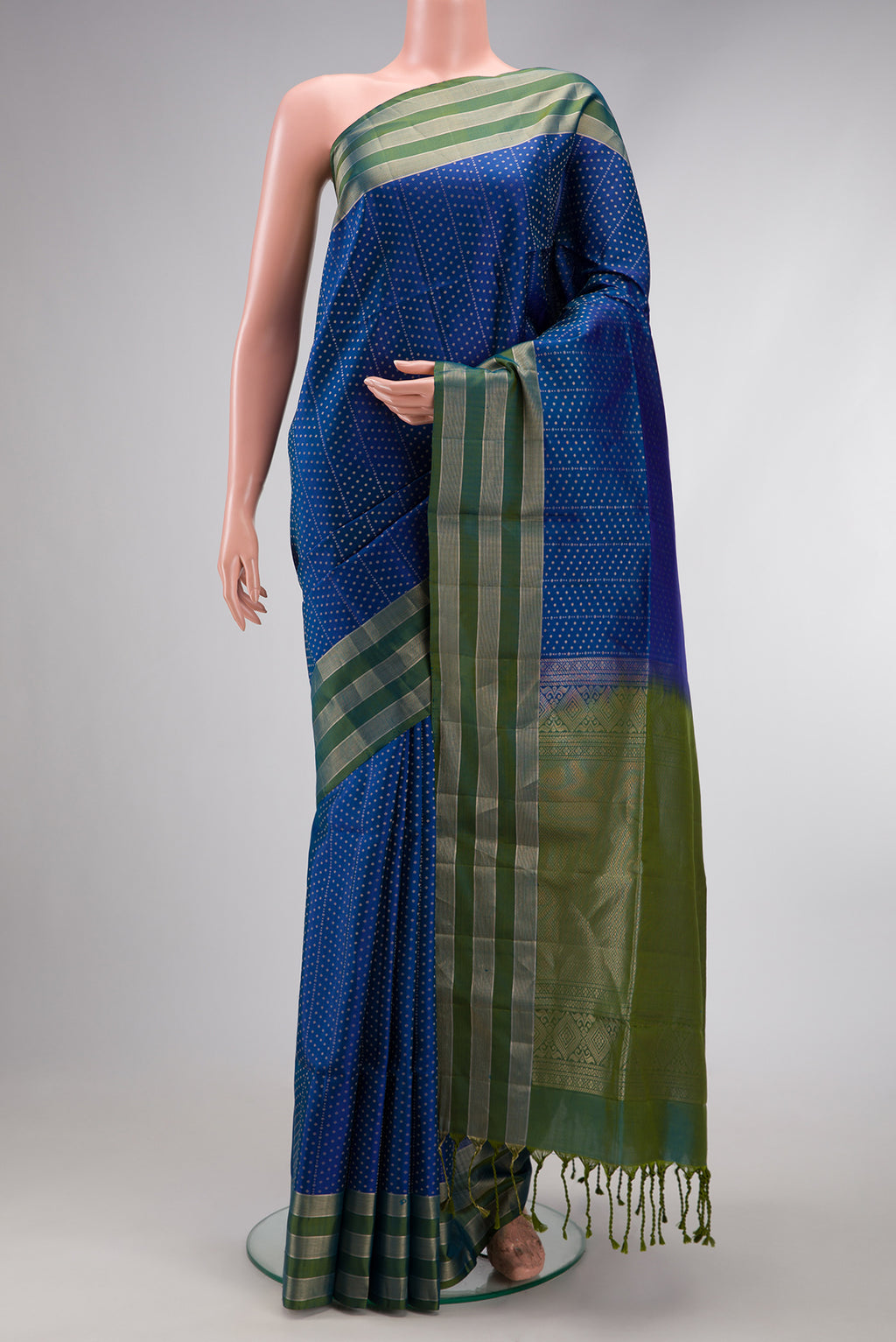 Peacock Blue Dual Tone Soft Silk Saree with Zari Butta on the body and Zari Border.  displayed on a mannequin
