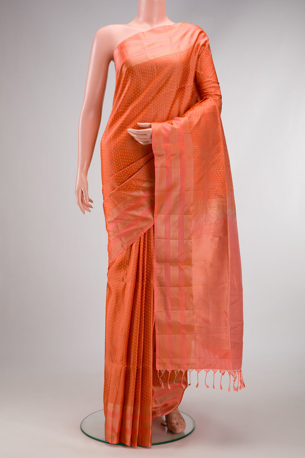 Beige and Off White Dual Tone Soft Silk Saree with Zari Brocade on the body and Fancy Border.  displayed on a mannequin