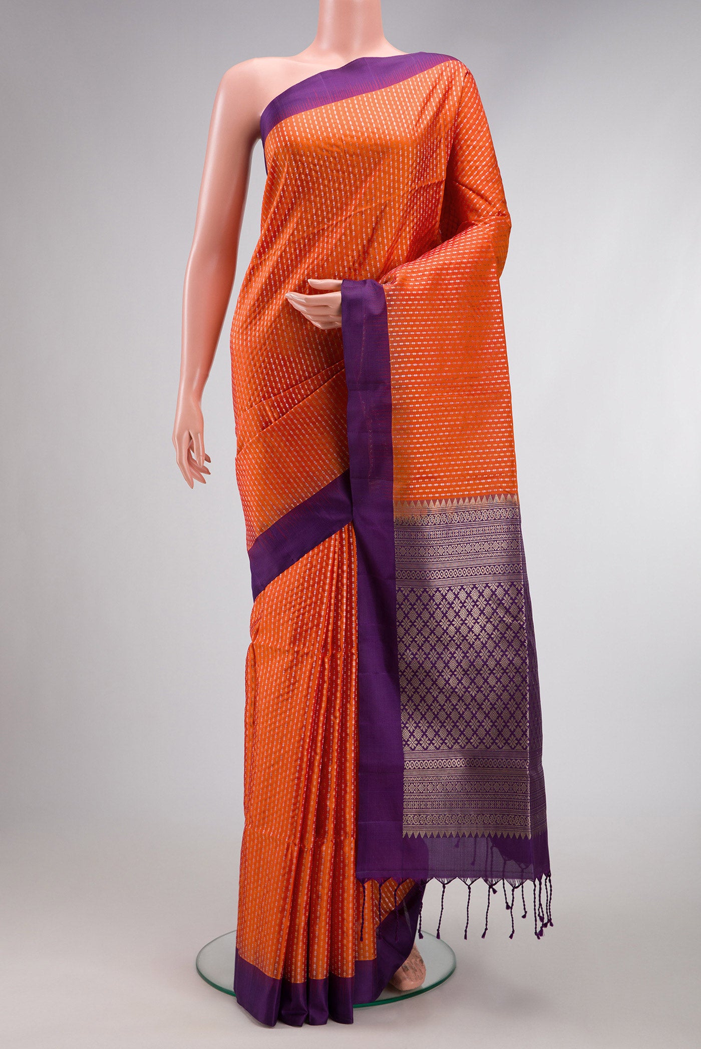 Orange Dual Tone Soft Silk Saree with Stripes on the body and Plain Border.  displayed on a mannequin