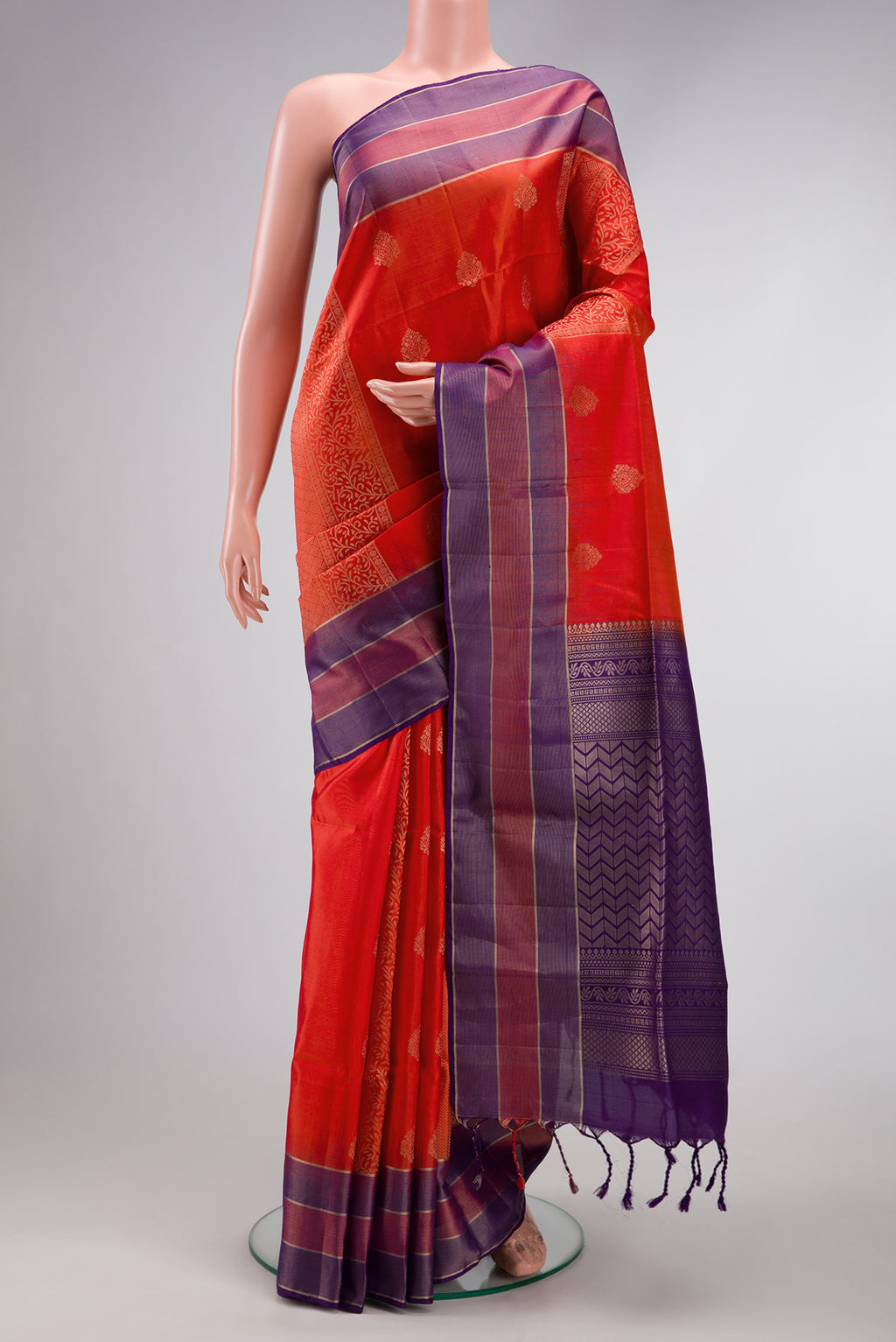 Orange Dual Tone Soft Silk Saree with Zari Butta on the body and Zari Border.  displayed on a mannequin