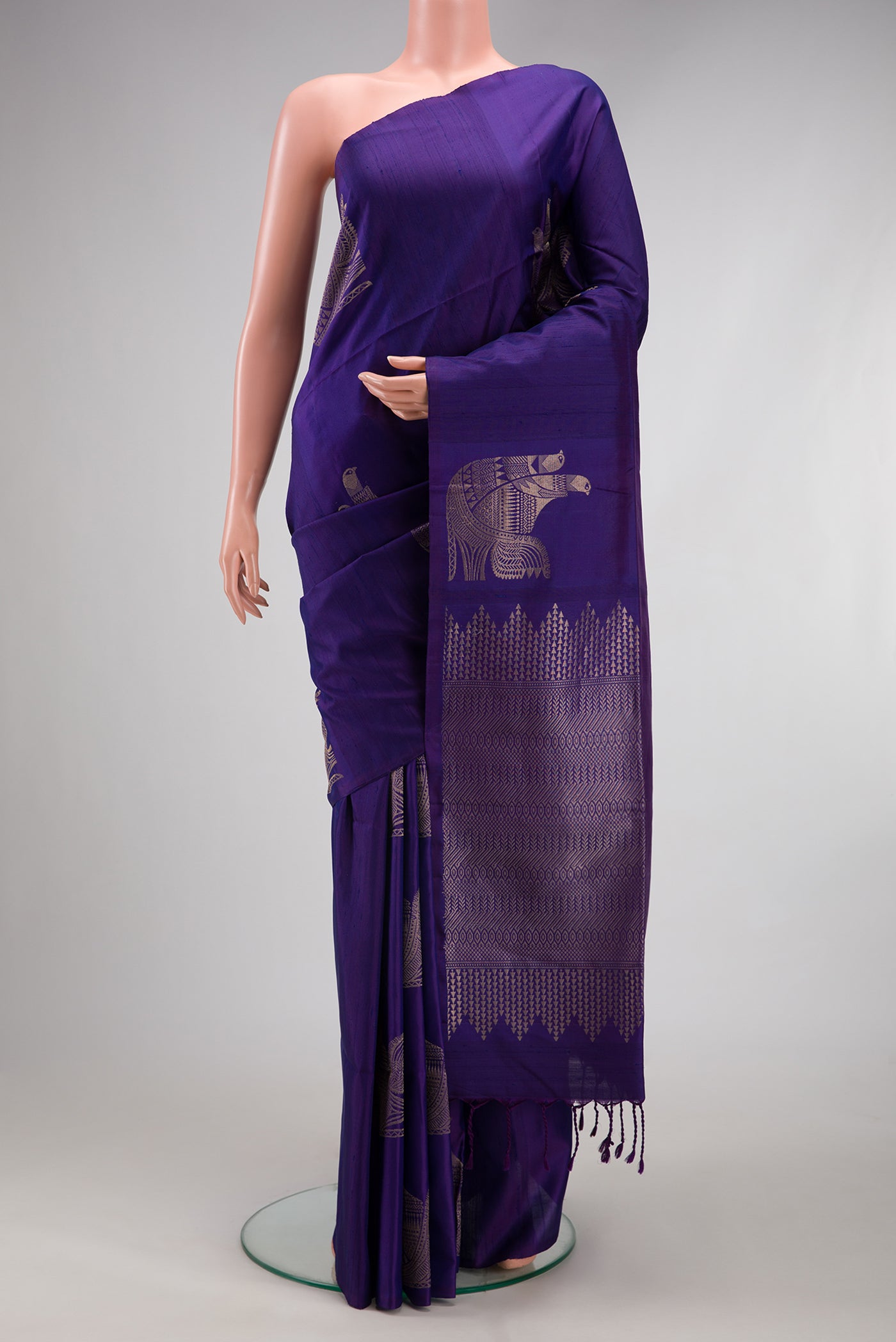 Dark Blue Soft Silk Saree with Zari Butta on the body and Without Border.  displayed on a mannequin