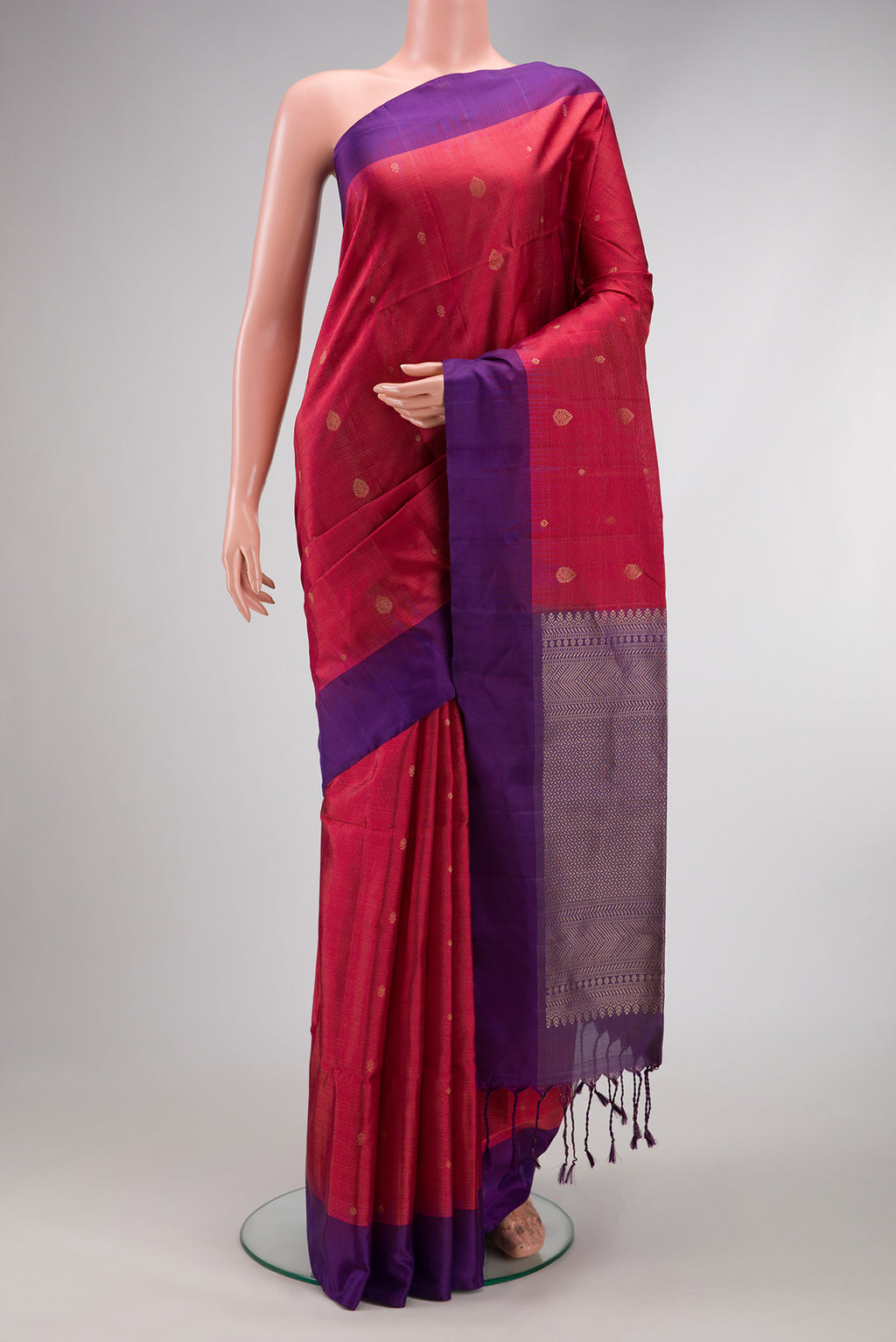Maroon Dual Tone Soft Silk Saree with Zari Butta on the body and Plain Border.  displayed on a mannequin
