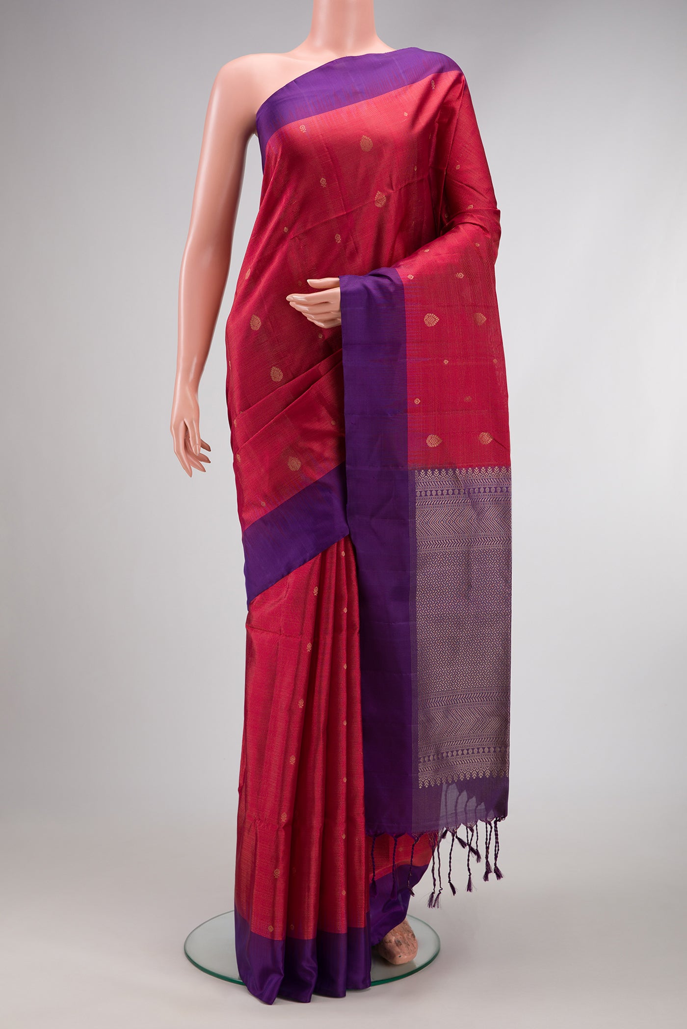 Maroon Dual Tone Soft Silk Saree with Zari Butta on the body and Plain Border.  displayed on a mannequin