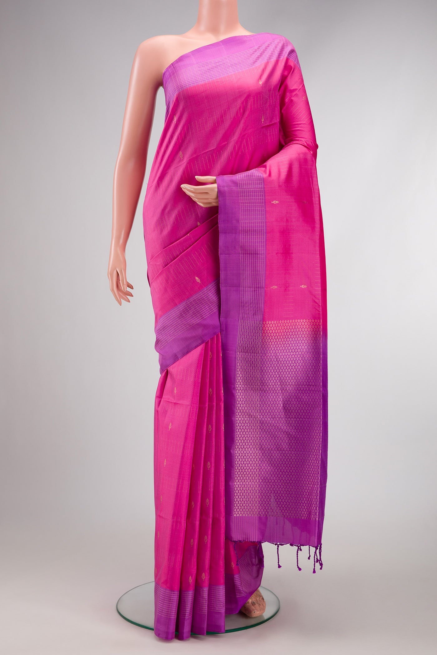 Pink Soft Silk Saree with Stripes on the body and Fancy Border.  displayed on a mannequin