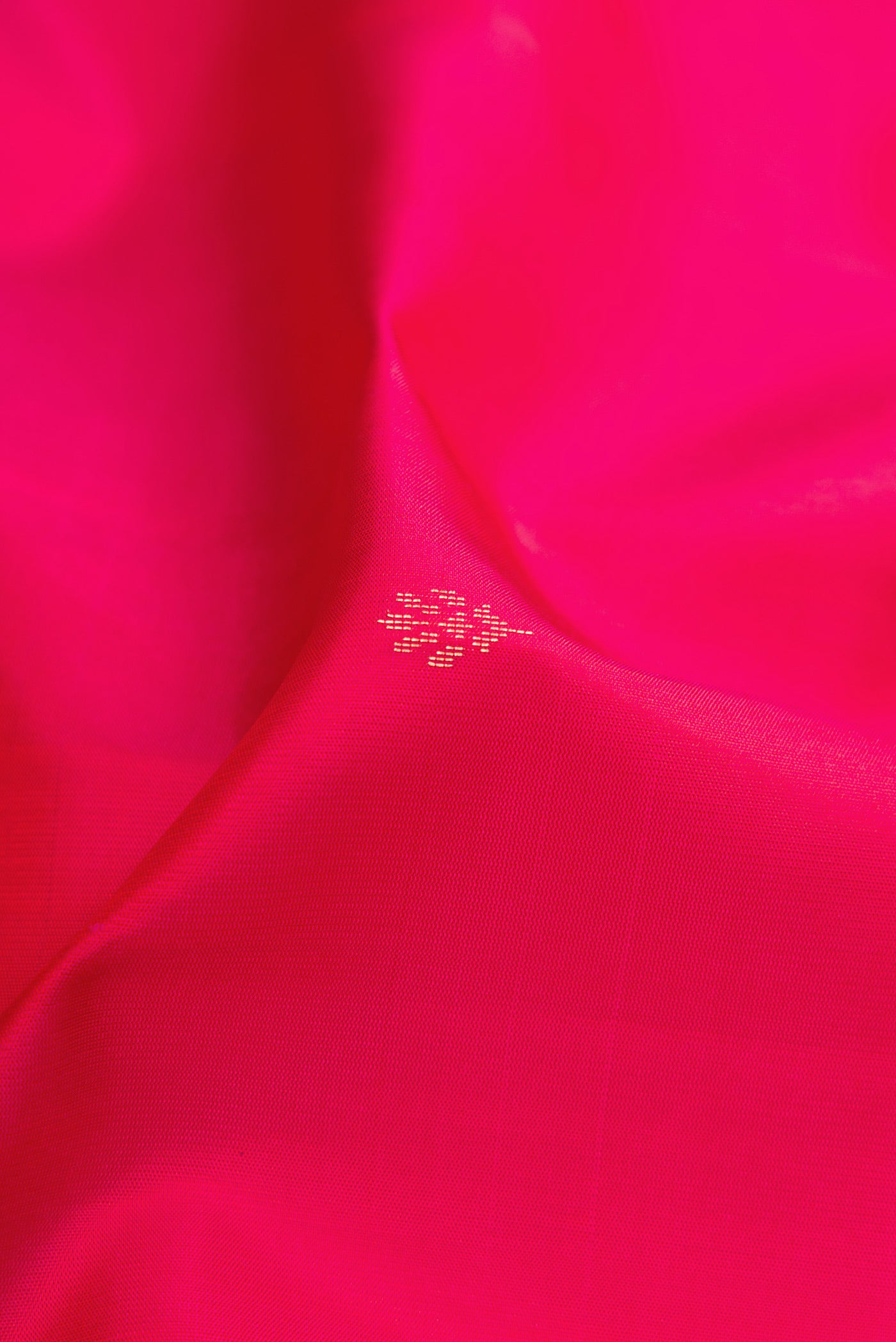 Close up of Pink Dual Tone Soft Silk Saree with Zari Butta on the body and Fancy Border.  displaying folds