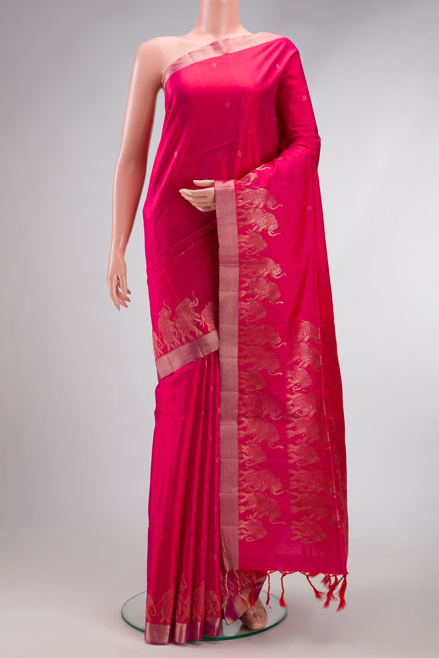 Pink Dual Tone Soft Silk Saree with Zari Butta on the body and Fancy Border.  displayed on a mannequin