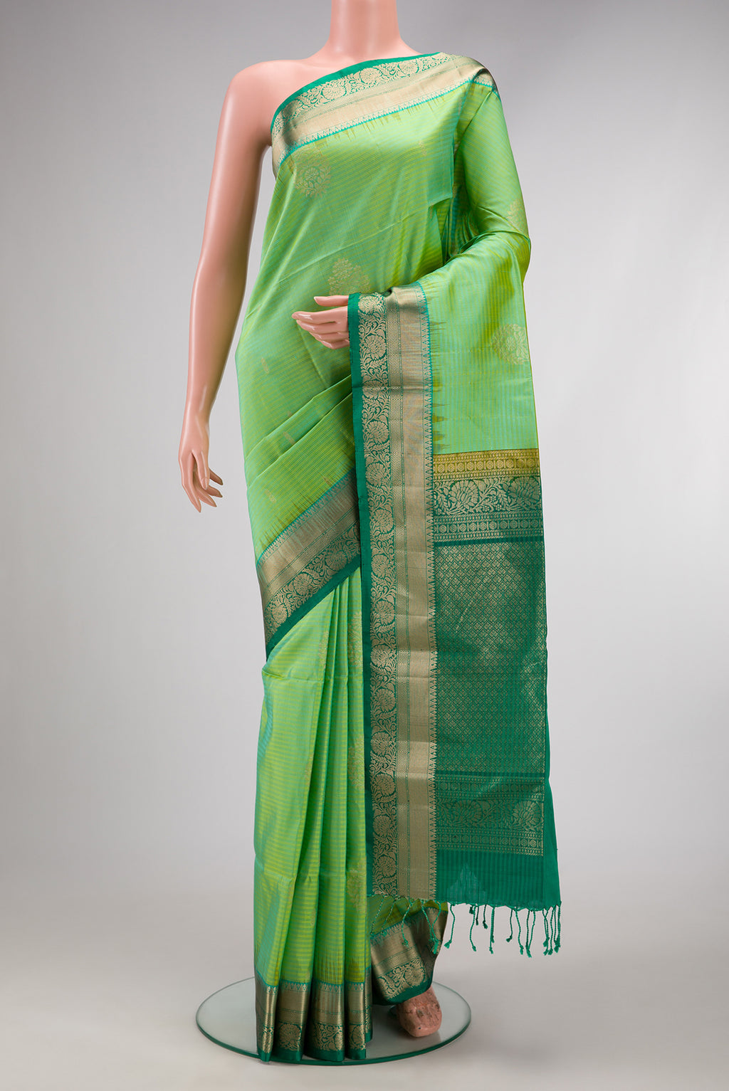 Beige and Off White Dual Tone Soft Silk Saree with Stripes on the body and Zari Border.  displayed on a mannequin