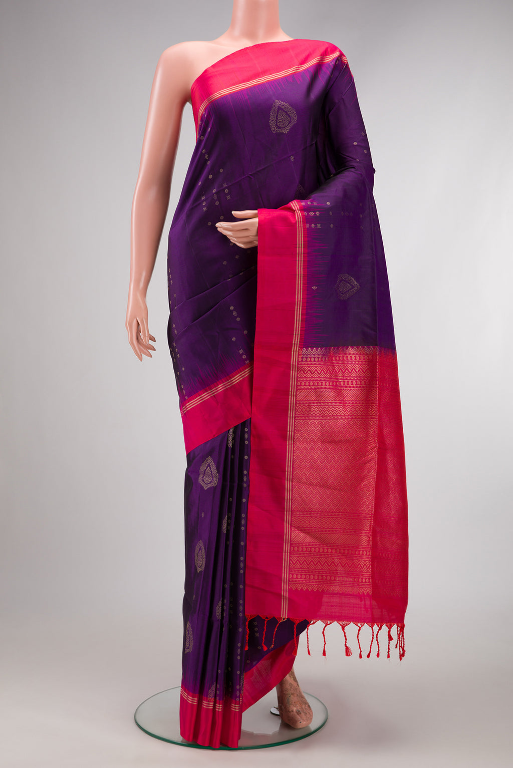 Violet Soft Silk Saree with Zari Butta on the body and Zari Border.  displayed on a mannequin