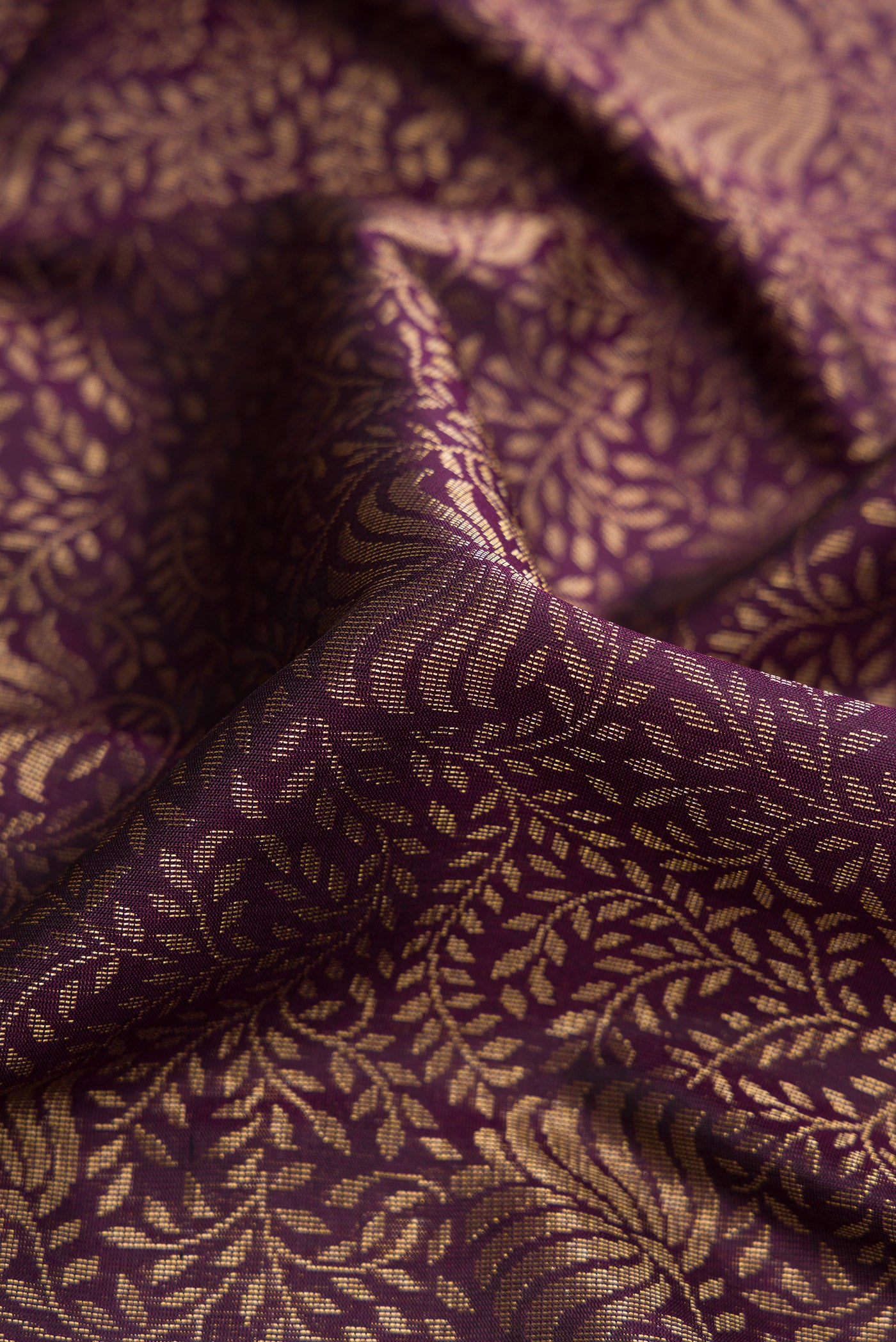 Close up of Brown Soft Silk Saree with Zari Brocade on the body and Plain Border.  displaying folds