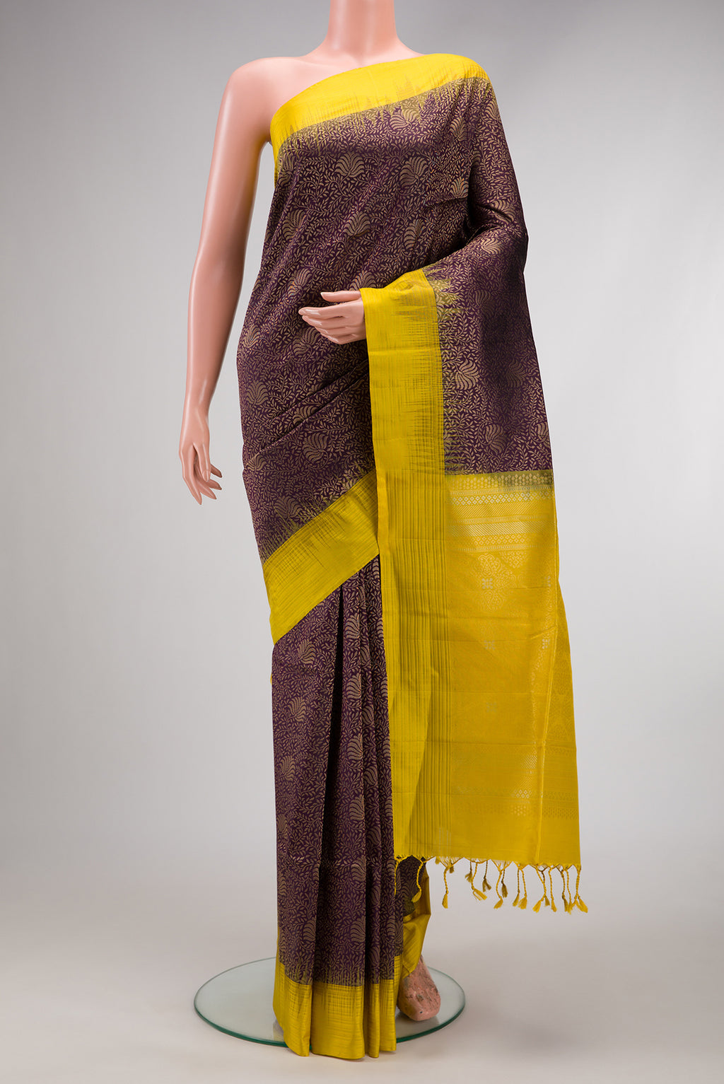 Brown Soft Silk Saree with Zari Brocade on the body and Plain Border.  displayed on a mannequin