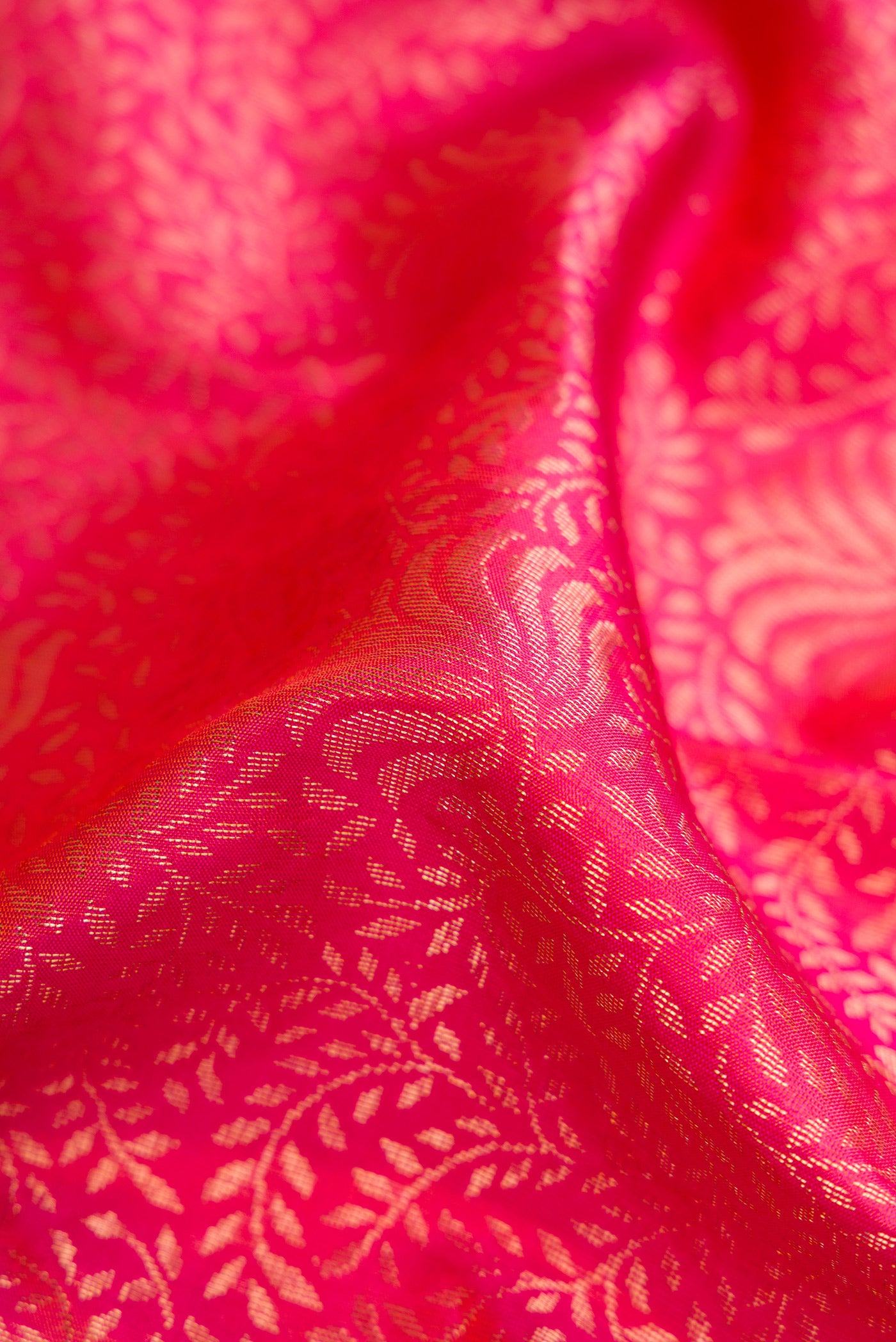 Close up of Pink Soft Silk Saree with Zari Brocade on the body and Plain Border.  displaying folds
