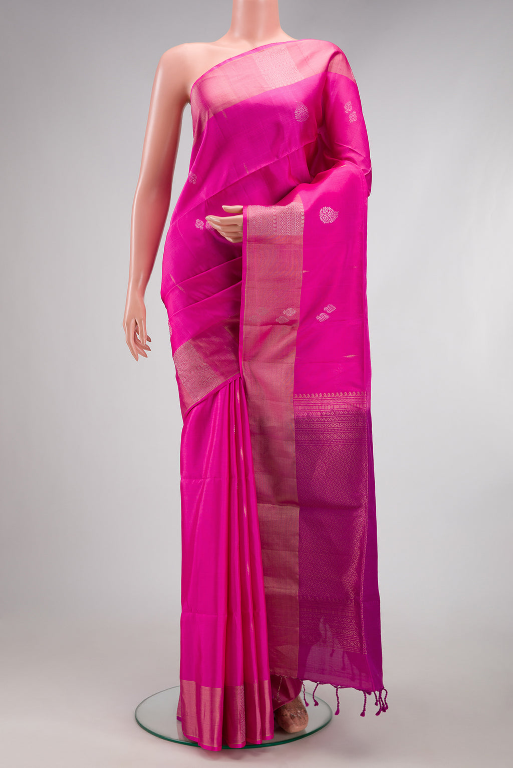 Pink Soft Silk Saree with Zari Butta on the body and Zari Border.  displayed on a mannequin