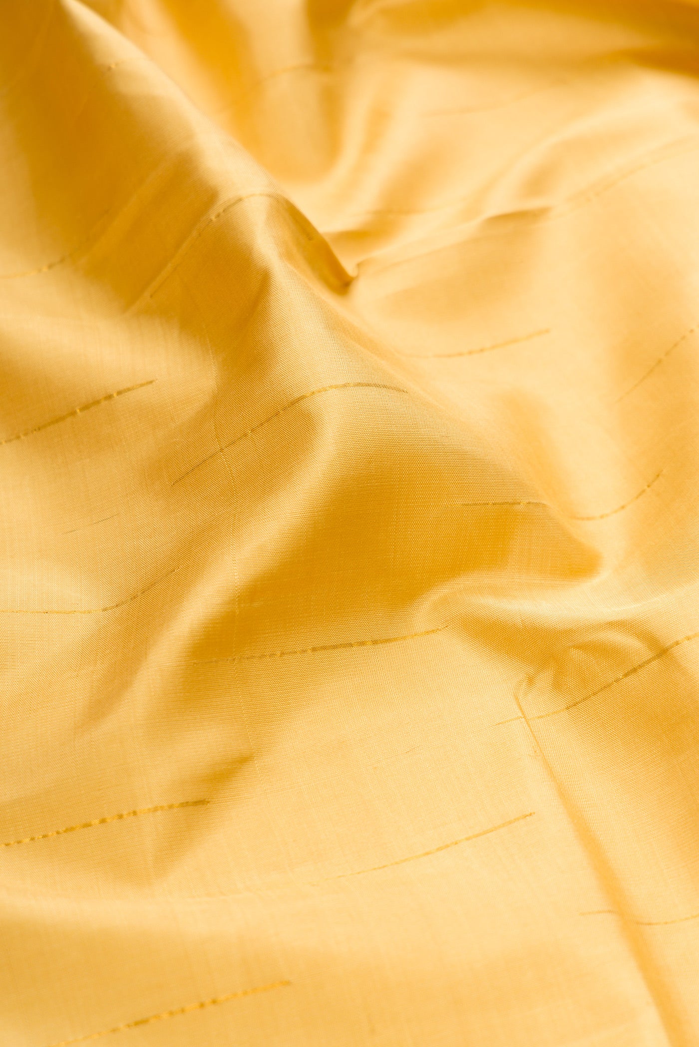 Close up of Sandal Kanchipuram Silk Saree with Stripes on the body and Fancy Border.  displaying folds