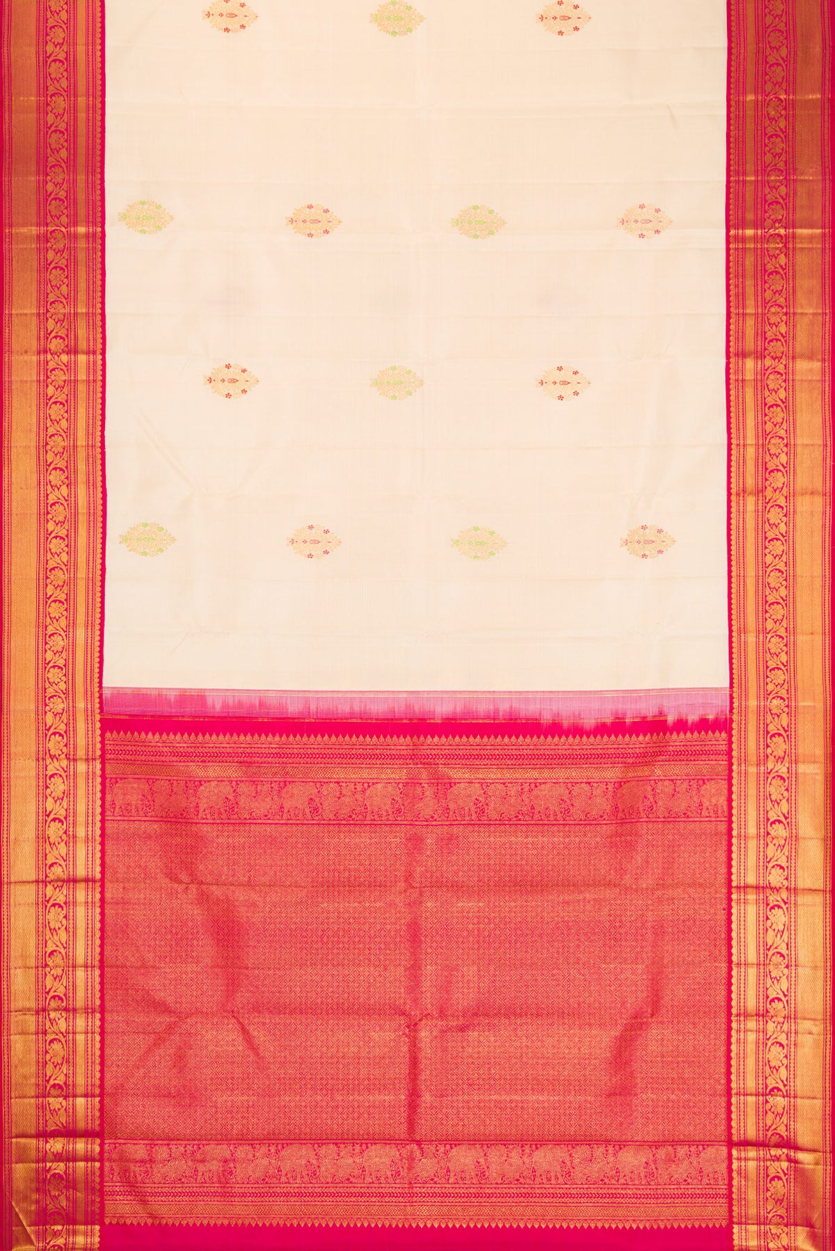 Flat view of Off White Kanchipuram Silk Saree with Zari And Thread Butta on the body and Zari Border. 