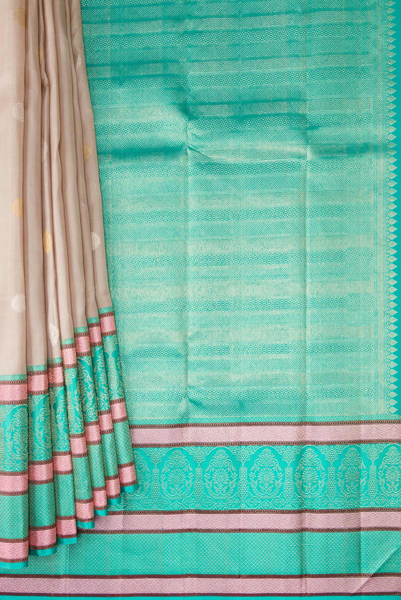 Pleats and pallu of Beige Dual Tone Kanchipuram Silk Saree with Zari Butta on the body and Zari And Thread Border. 