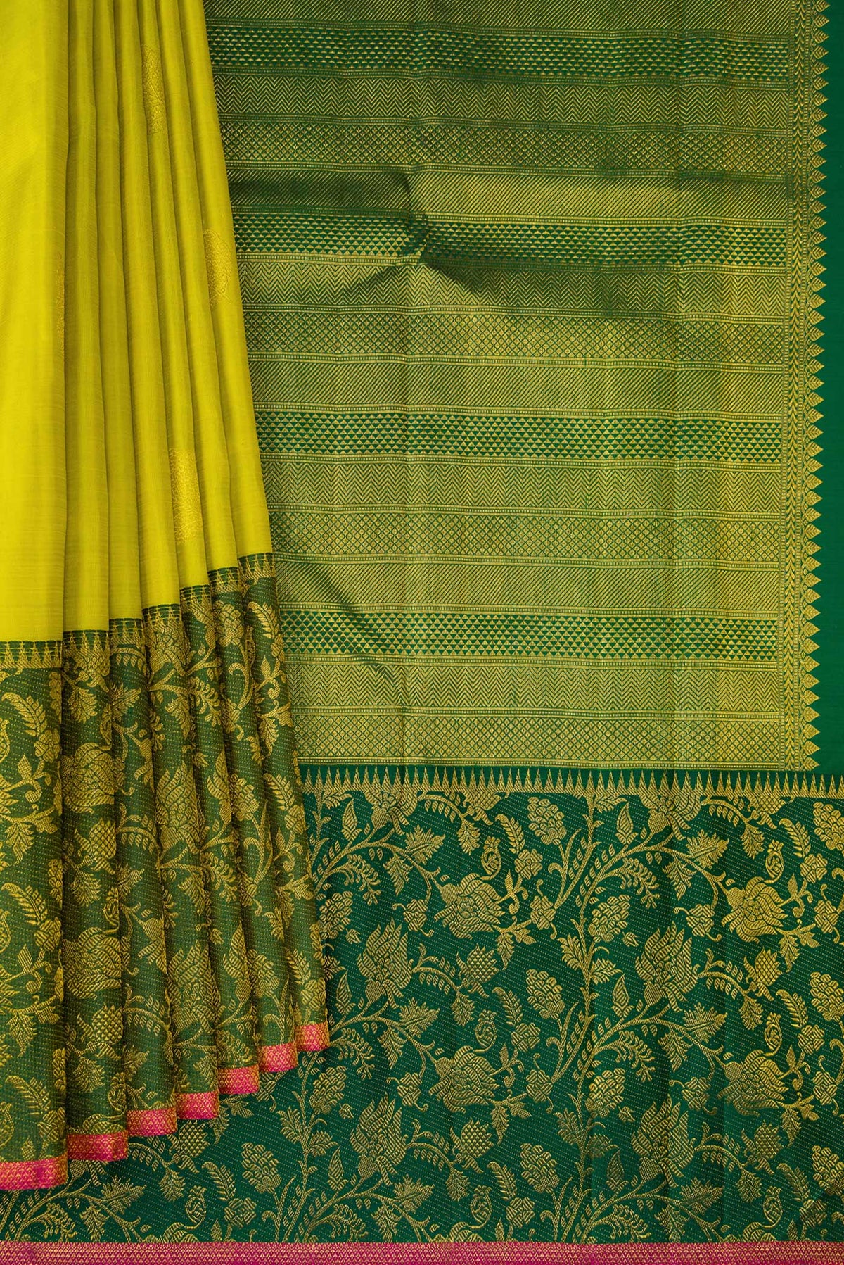 Pleats and pallu of Parrot Green Dual Tone Kanchipuram Silk Saree with Zari Butta on the body and Fancy Border. 