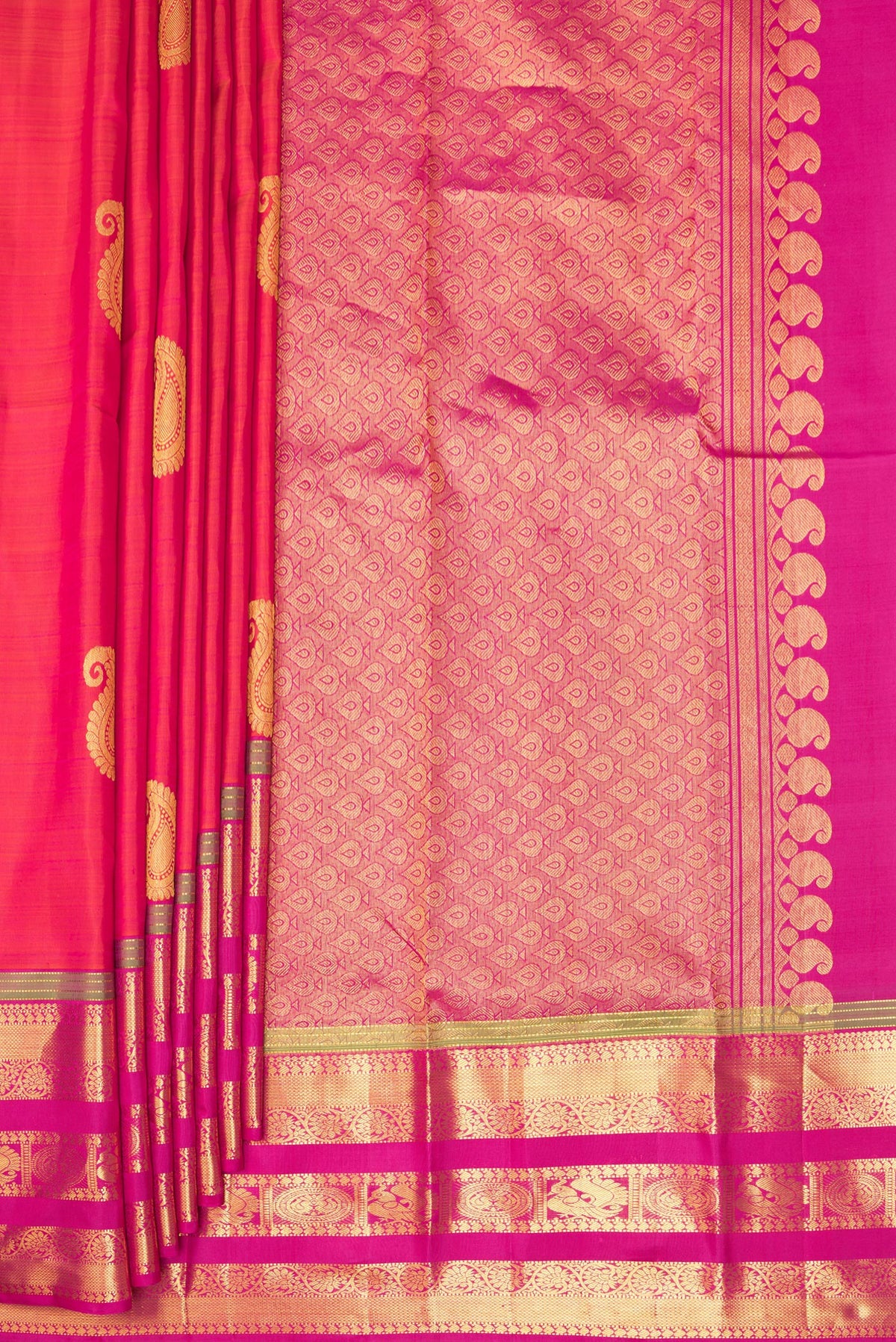 Pleats and pallu of Pure Silk Orange Kanchipuram Saree with Zari Butta on the body and Zari Border. 
