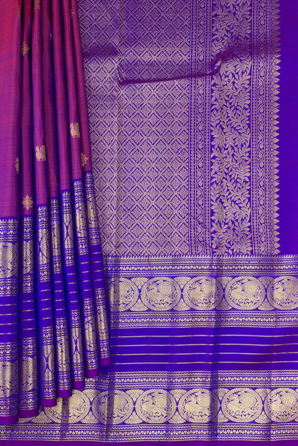 Pleats and pallu of Purple Kanchipuram Silk Saree with Zari Butta on the body and Zari Border. 