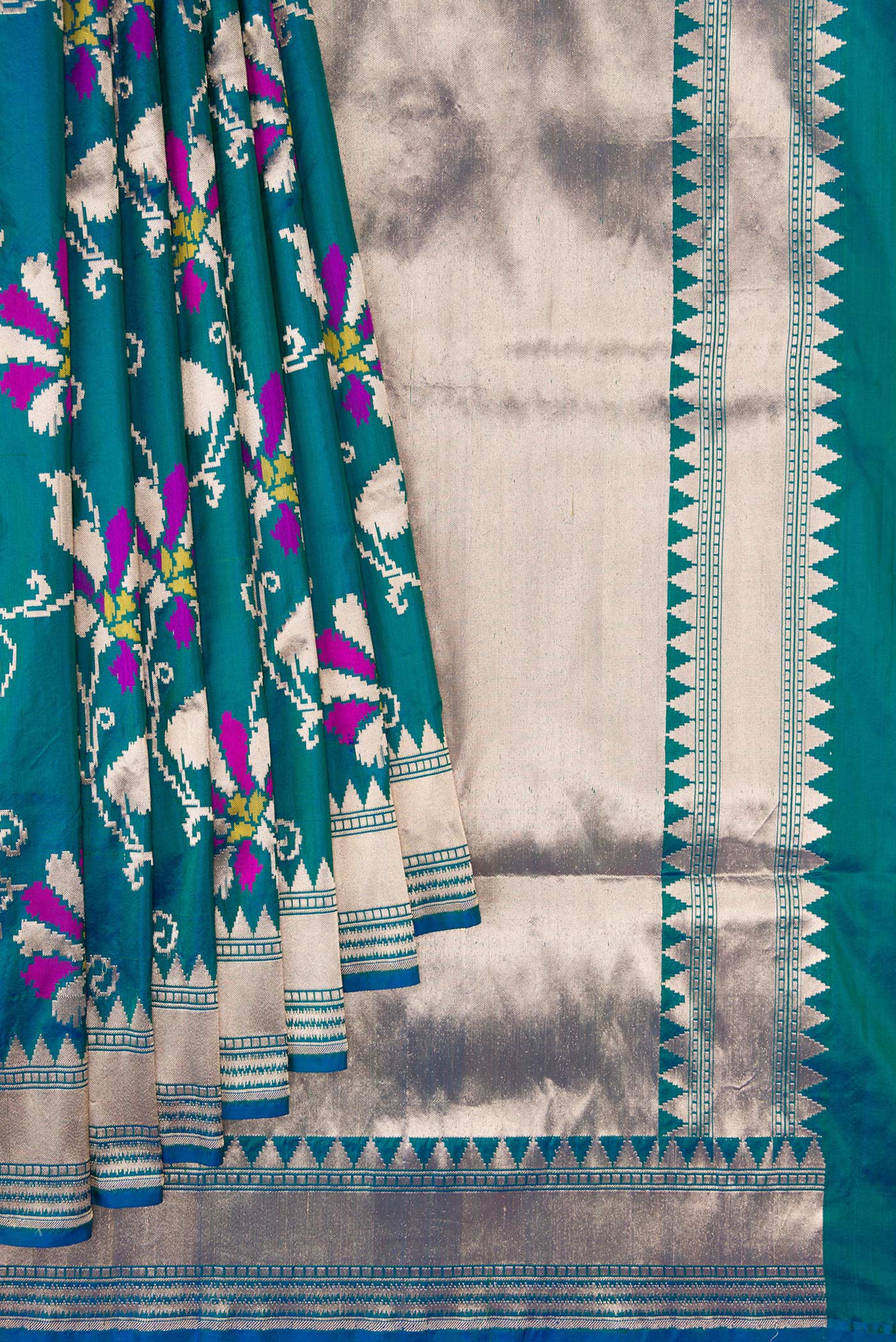 Pleats and pallu of Peacock Blue Dual Tone Banarasi Silk Saree with Zari Butta on the body and Zari Border. 