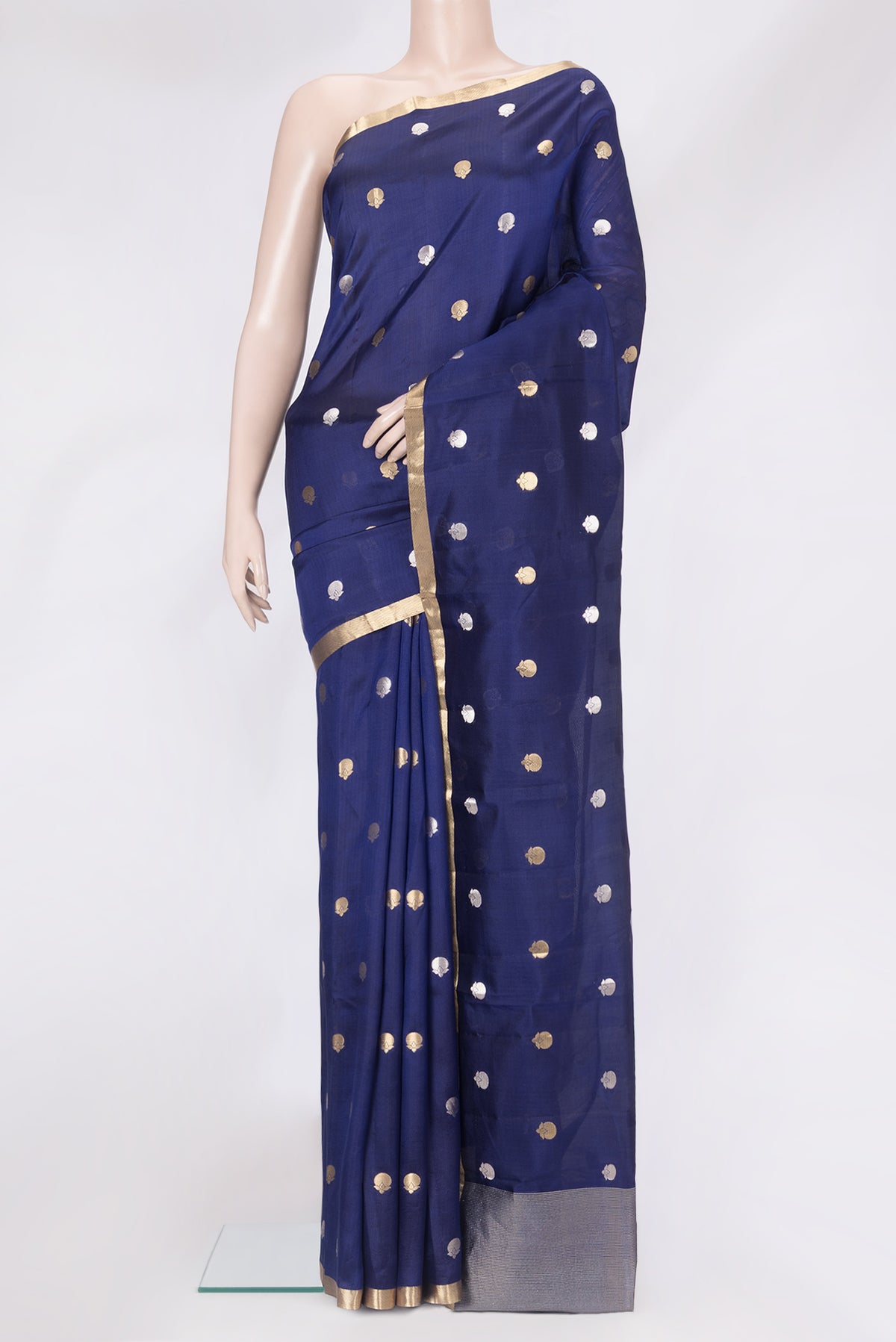 Navy Blue Tussar Silk Saree with Zari Butta on the body and Zari Border.  displayed on a mannequin
