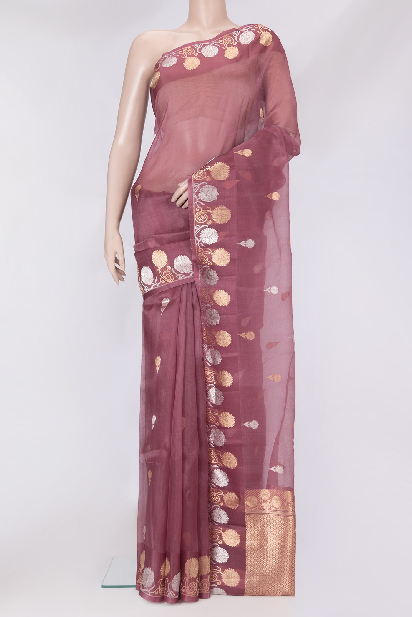 Pink Organza Silk Saree with Zari Butta on the body and Fancy Border.  displayed on a mannequin