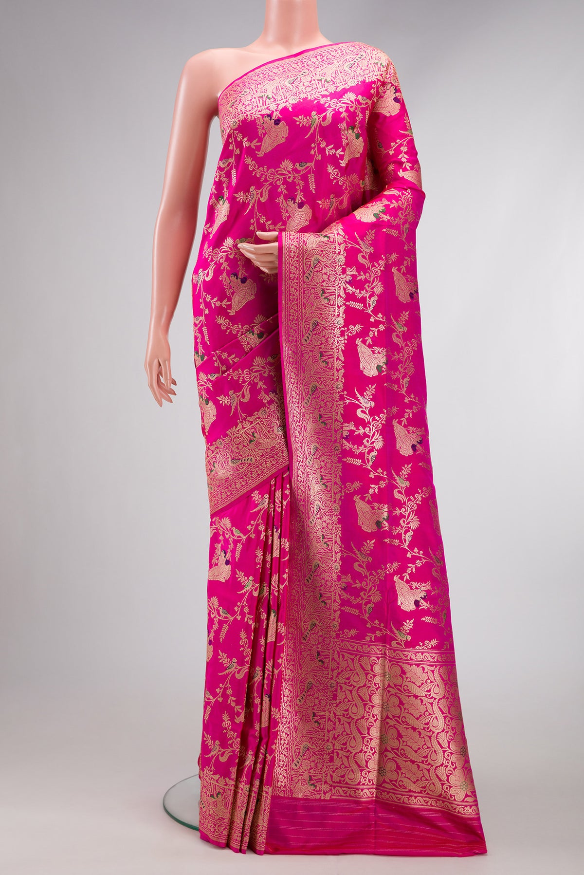 Pink Banarasi Silk Saree with Zari Butta on the body and Zari Border.  displayed on a mannequin
