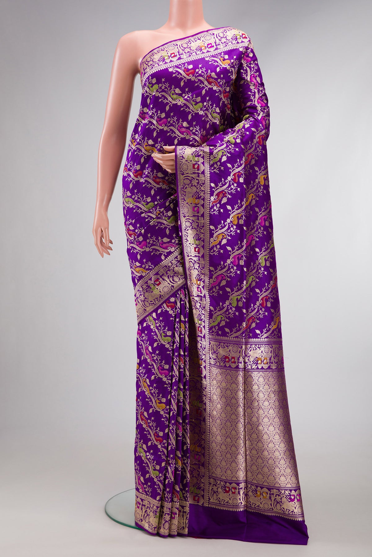 Violet Dual Tone Banarasi Silk Saree with Zari Butta on the body and Zari Border.  displayed on a mannequin