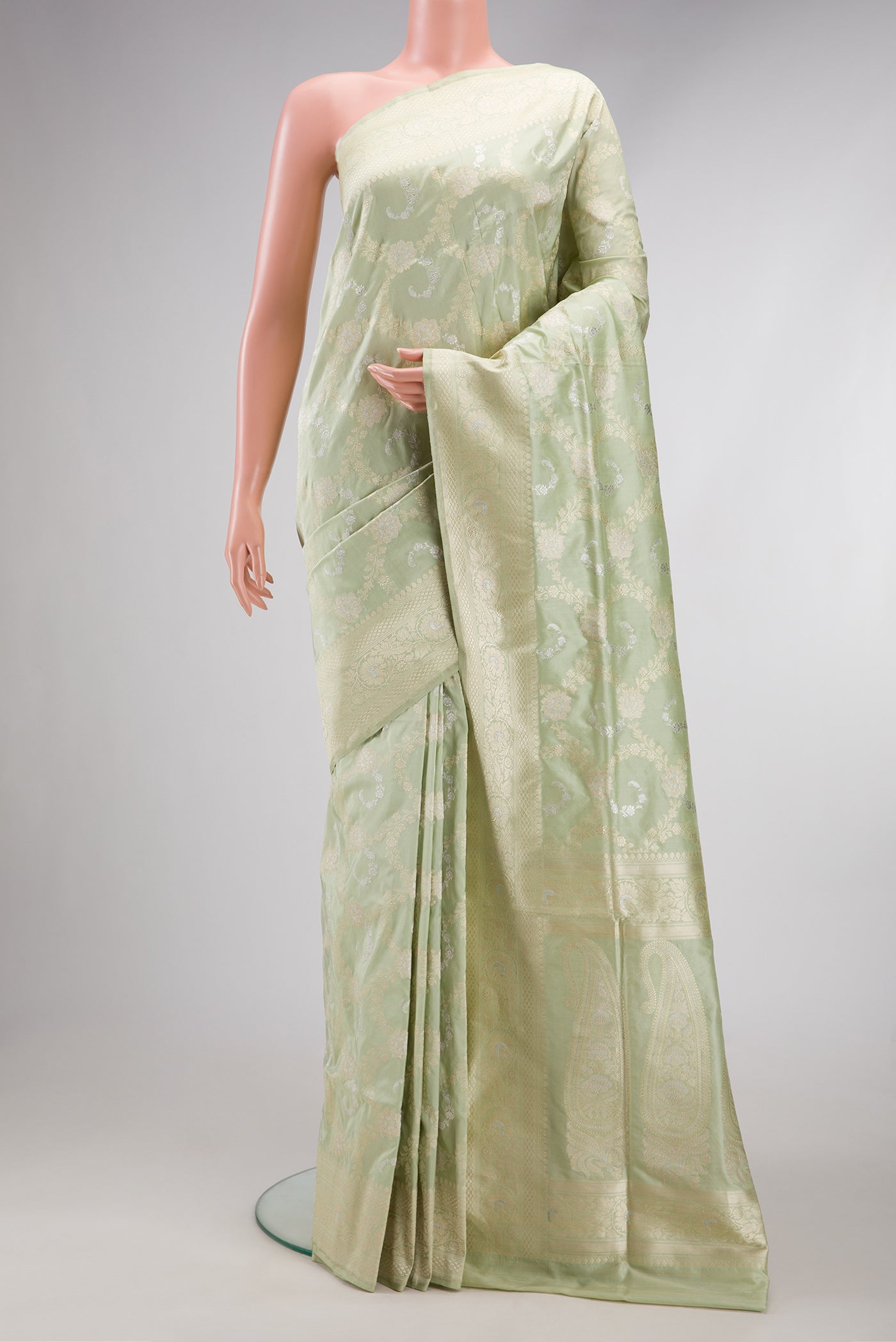 Pista Green Dual Tone Banarasi Silk Saree with Zari Brocade on the body and Zari Border.  displayed on a mannequin