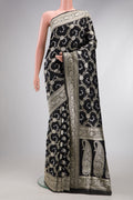 Black Dual Tone Banarasi Silk Saree with Zari Butta on the body and Zari Border.  displayed on a mannequin