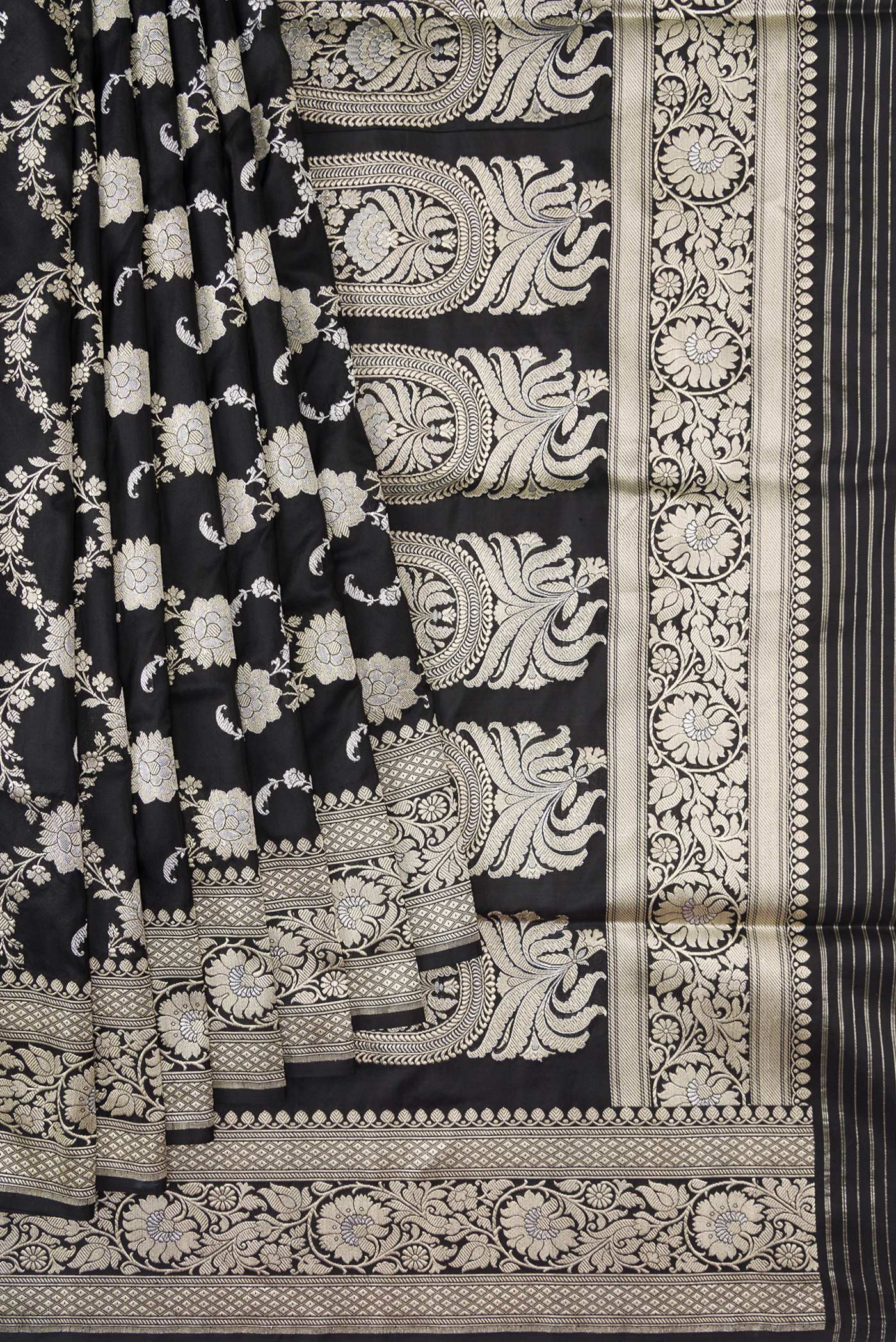 Pleats and pallu of Black Dual Tone Banarasi Silk Saree with Zari Butta on the body and Zari Border. 