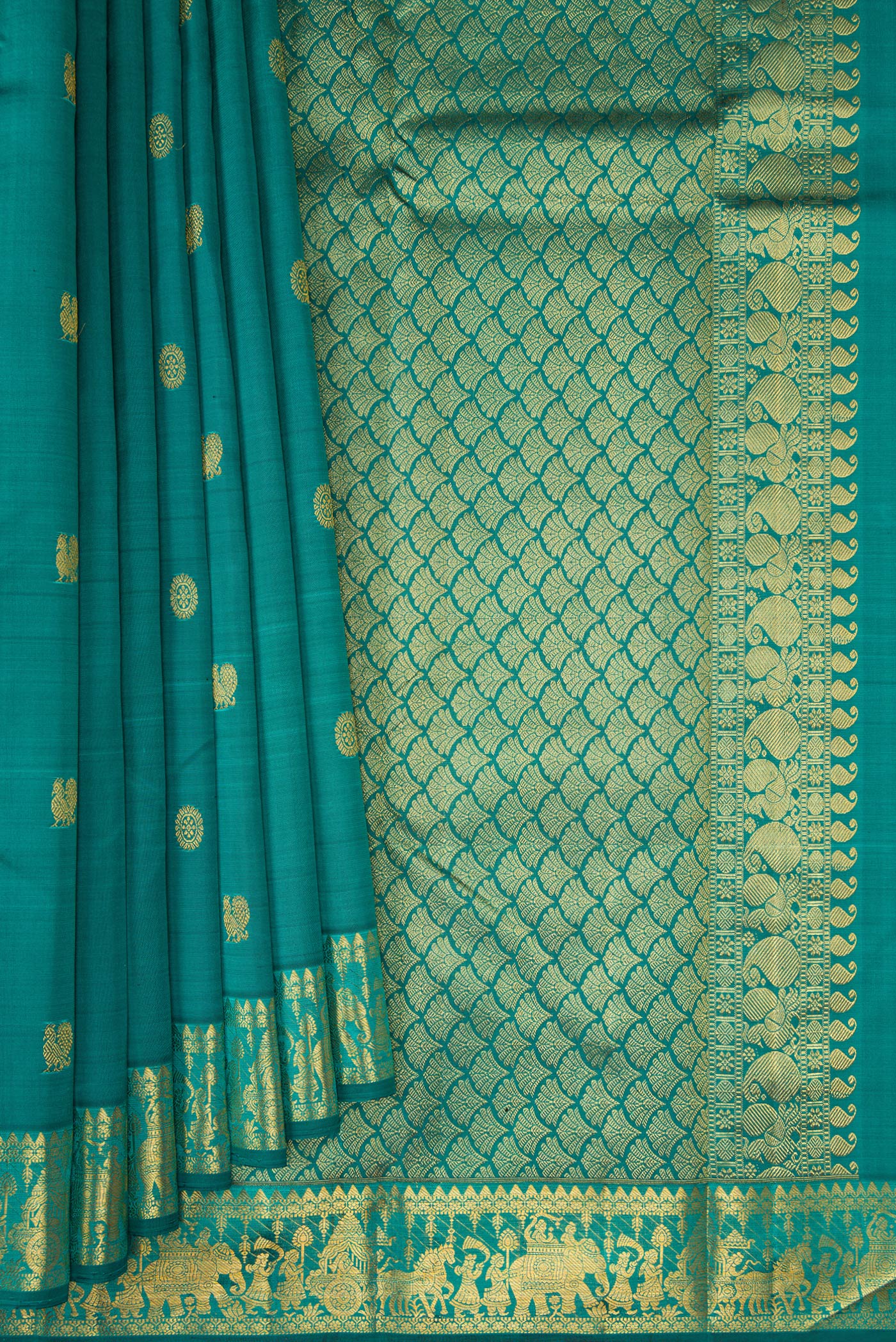 Pleats and pallu of Teal Kanjivaram Silk Saree with Zari Butta on the body and Zari Border. 