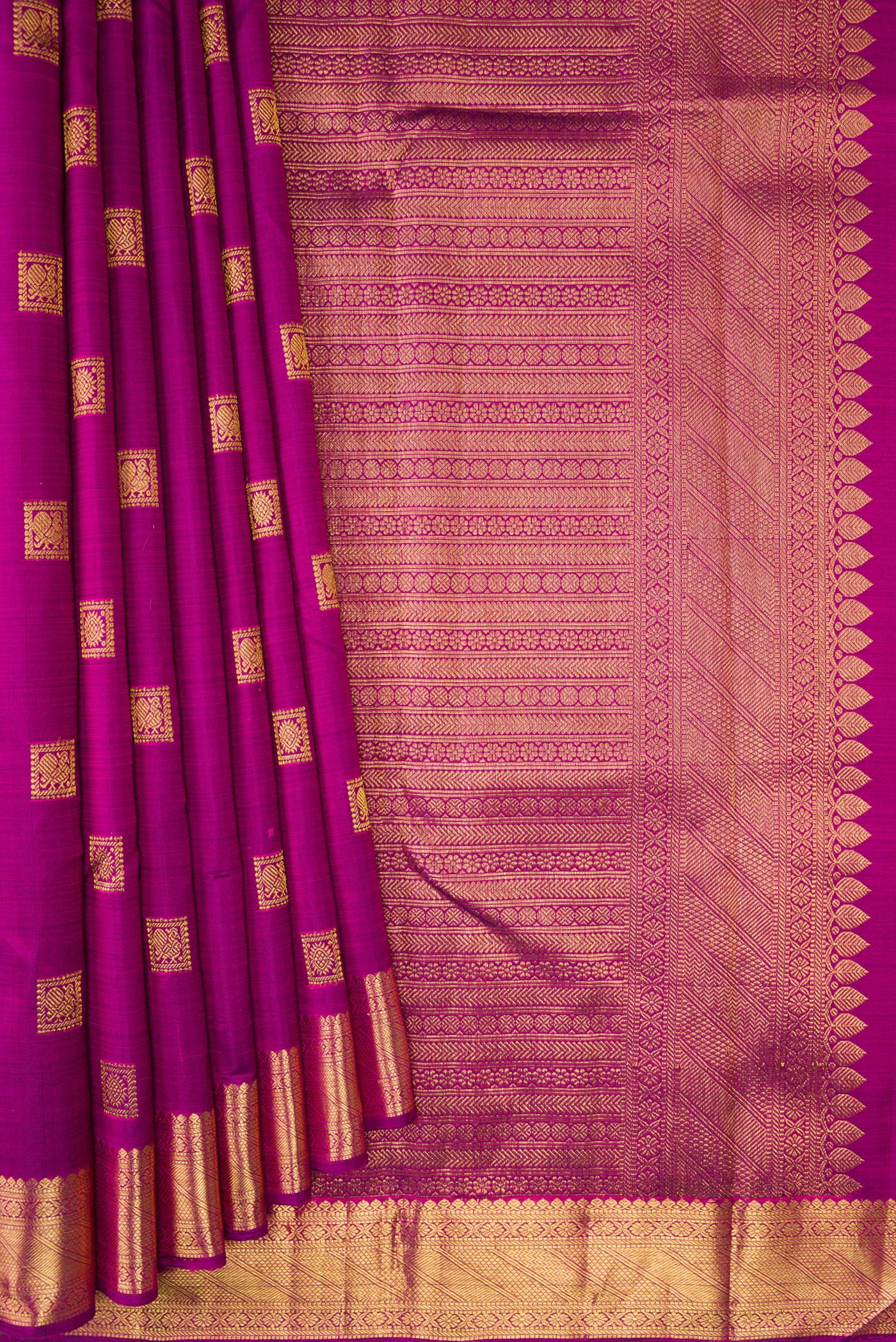 Pleats and pallu of Purple Kanjivaram Silk Saree with Zari Butta on the body and Zari Border. 