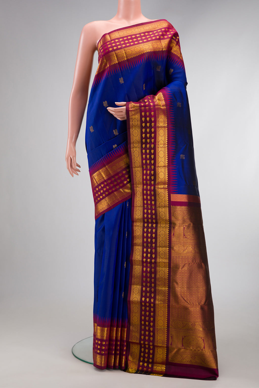 Royal Blue Dual Tone Kanjivaram Silk Saree with Zari Butta on the body and Zari Border.  displayed on a mannequin
