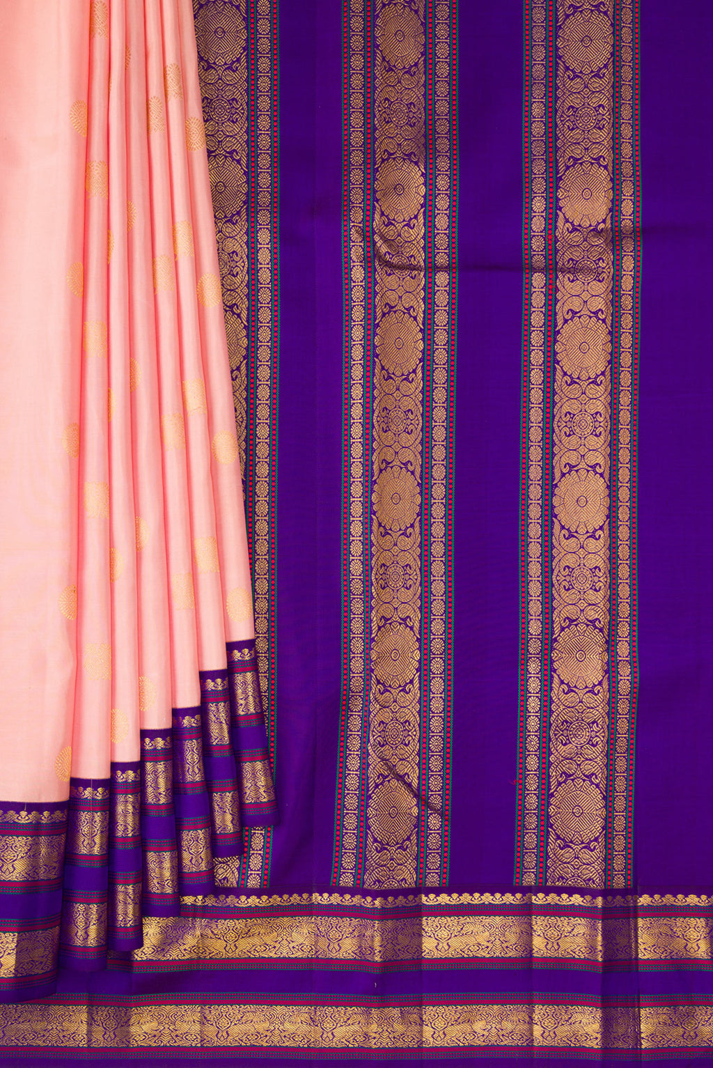 Pleats and pallu of Pure Silk Peach Kanjivaram Saree with Zari Butta on the body and Zari Border. 
