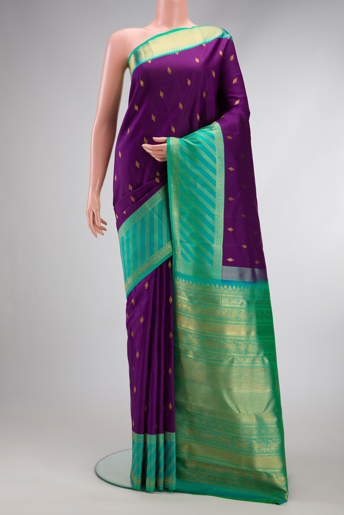Purple Dual Tone Kanjivaram Silk Saree with Zari Butta on the body and Zari Border.  displayed on a mannequin