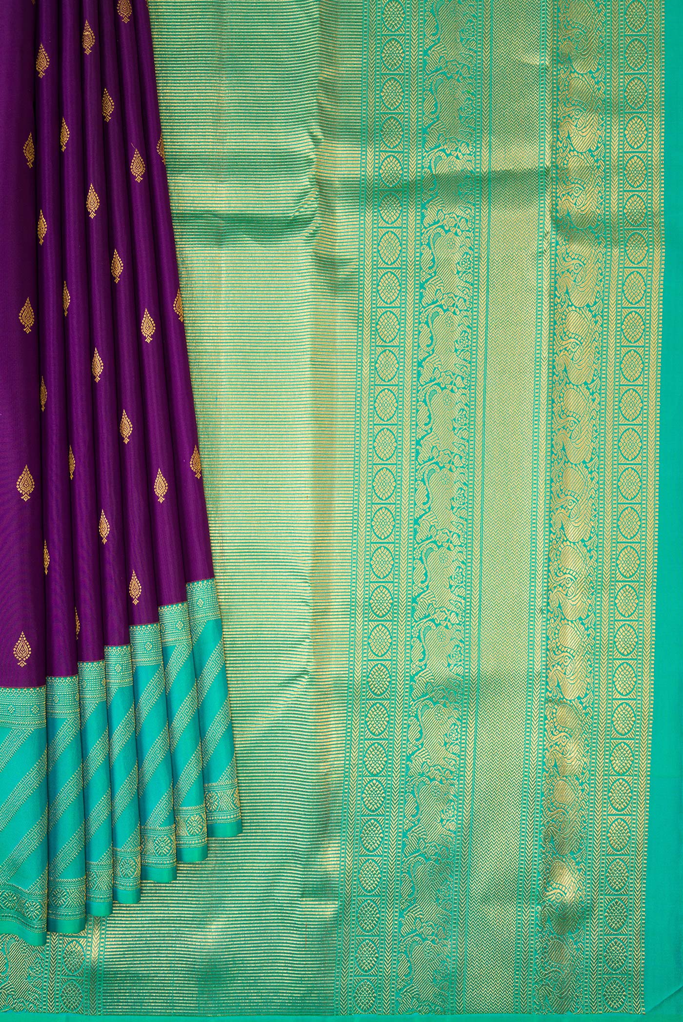 Pleats and pallu of Purple Dual Tone Kanjivaram Silk Saree with Zari Butta on the body and Zari Border. 
